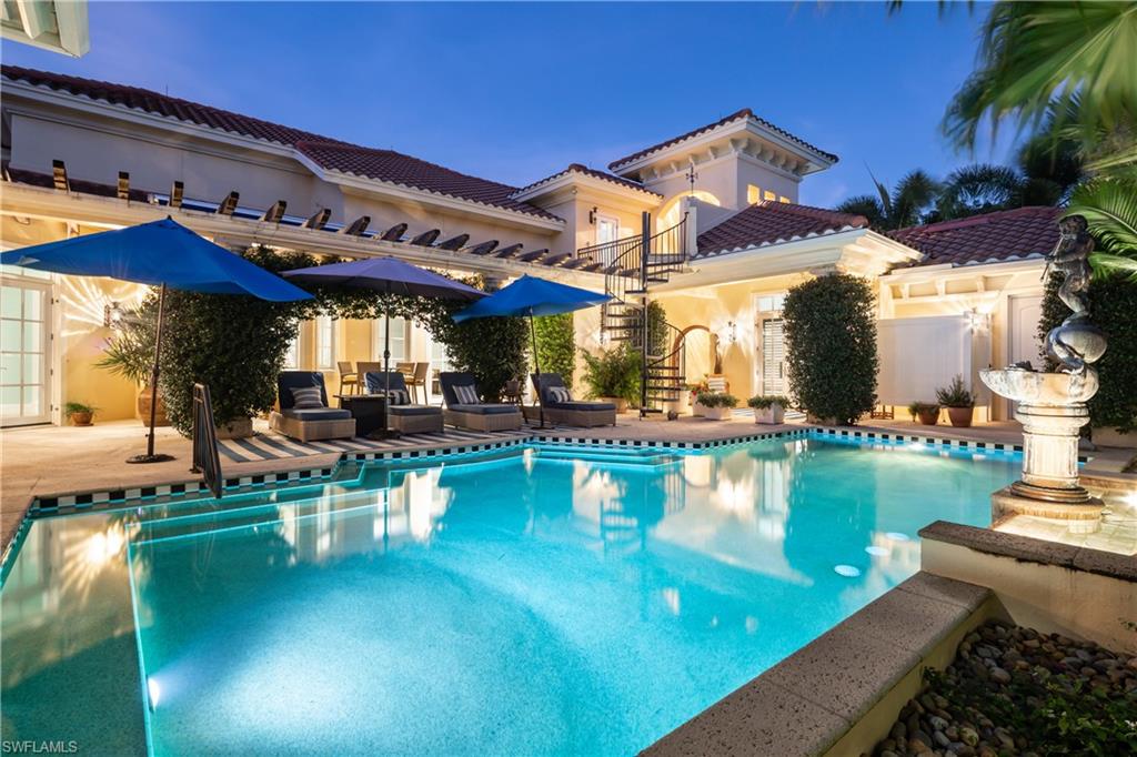 Beautifully renovated estate offering breathtaking golf course and lake views in the coveted Bonita Bay community. Highly sought-after western exposure provides stunning sunset views over the course and ideal sun over the pool. Enter through new handcrafted mahogany doors into a private courtyard oasis featuring lush landscaping, a pool with a fountain and new equipment, spa, outdoor shower, and ample lounging space. The residence offers over 6,000 square feet of living space with 6 bedrooms, and 4.5 baths, including a 1 bedroom/1 bath guest house/pool cabana. Notable upgrades include a 2013 roof, whole-house generator (2023) with 500-gallon propane tank, new water heater (2022), and four HVAC systems replaced within the past four years. Every detail has been thoughtfully curated, from travertine and engineered hardwood flooring to soaring ceilings with custom coffered details and new hurricane impact French doors that flood the home with natural light. The chef’s kitchen is designed for entertaining and features dual islands, quartz countertops, white cabinetry, dual sinks, a cozy breakfast nook, and a spacious butler’s pantry. An adjacent formal dining room provides an elegant setting for gatherings. Step outside to a tranquil seating area overlooking the golf course, or relax in the additional screened lanai offering a shaded retreat. The spacious primary suite includes a sitting area and spa-like bath with dual vanities, a large walk-in shower, and a standalone tub. Upstairs, a bonus living area, guest bedroom, den, and outdoor terrace offer direct access to the pool. The separate pool cabana/guest house across the courtyard includes a guest bedroom with ensuite bath, ideal for visitors and extended stays. Additional features include motorized awnings, retractable screens, a gas fireplace, generous upstairs storage, freshly painted exterior (2022), and a Sonos sound system. Bonita Bay residents enjoy exclusive amenities such as a private Beach Park, over 12 miles of walking and biking trails, three parks, pickleball courts, a marina, and an on-site restaurant. Optional membership to Bonita Bay Club offers five championship golf courses, tennis, fitness facilities, and multiple dining venues. Ideally located just minutes from the airport and a short drive to downtown Bonita Springs’ dining, coffee bars, craft cocktails, and live music, this exceptional home offers a perfect blend of luxury, privacy, and community—truly the best of Bonita Springs living.