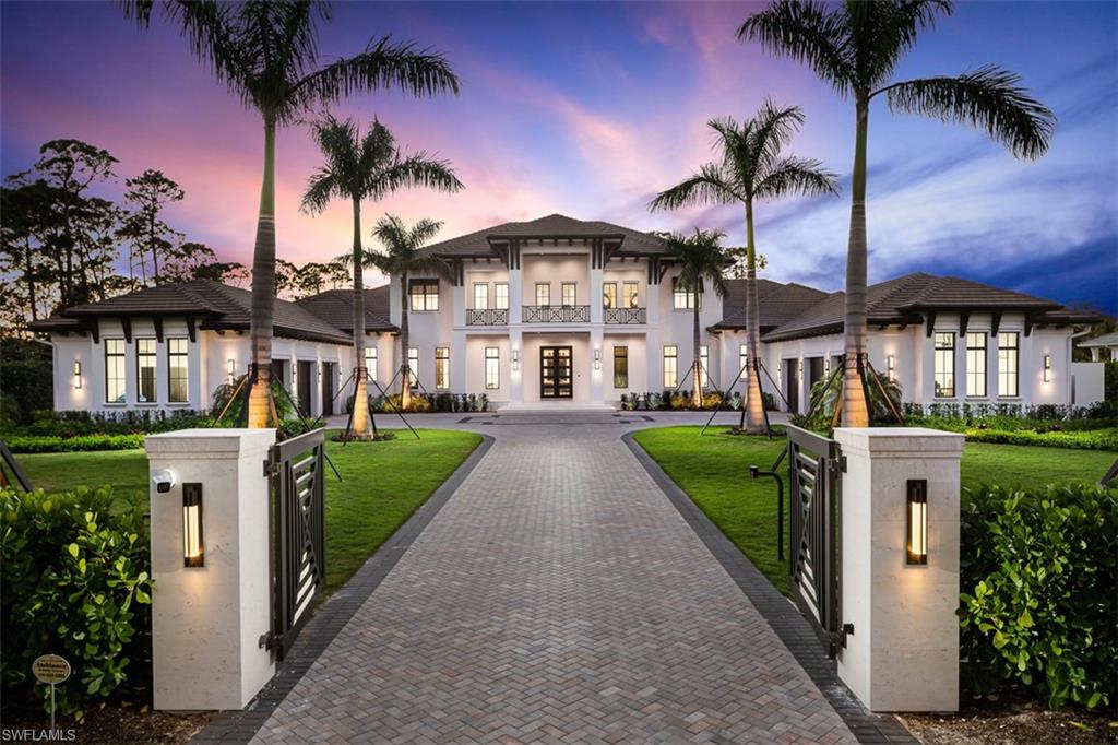 This exceptional newly constructed home on Cajeput Drive is a showcase of timeless elegance that will exceed the expectations of even the most discerning buyers. Simply put this Estate checks all the boxes. Boasting five bedrooms, a den, and eight bathrooms, designed with entertaining in mind. As you step inside your grand foyer, you will be greeted by a spacious glass and hardwood staircase, a billiards room, a see-through aquarium, and a magnificent marble bar with ample seating. The main floor features your master, two offices, a chef's kitchen, an oversized bonus room, a VIP suite with private lanai, two laundries and a resort-style pool with a sunken fire pit. The extensive covered lanai revolves around a linear fireplace and includes a large outdoor bar with a kitchen and a dedicated pool bathroom. Upstairs, there are three ensuite bedrooms, your third laundry and den with a cozy balcony overlooking your pool. This home has been lightly lived in for less than six months and is ready for you to call it your own.