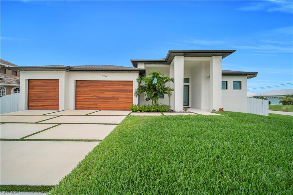 Experience the best of Southwest Florida living in this beautiful 4 bedrooms 3 1/2 bath pool home located in the highly sought-after Southwest Cape Coral area! Designed for both comfort and entertaining, this home features a bright, open-concept floor plan with soaring ceilings, abundant natural light, and elegant Italian and Spanish tile flooring throughout.

The spacious kitchen is the heart of the home, showcasing a large center island, stainless steel appliances, and plenty of space for gathering with family and friends. The primary suite offers a peaceful retreat with a generous walk-in closet.

Step outside to your own private backyard oasis, complete with a saltwater swimming pool, a fully equipped outdoor kitchen, and a private fenced yard—perfect for entertaining or enjoying Florida's year-round sunshine. An automatic irrigation system helps keep the landscaping lush and beautiful with ease.

Conveniently located near shopping, dining, golf courses, marinas, and Cape Coral's waterfront amenities, this exceptional home offers the perfect combination of comfort, style, and location. Whether you're looking for a primary residence, vacation getaway, or investment opportunity, this Southwest Cape Coral pool home is one you won't want to miss.

Schedule your private showing today and discover the Florida lifestyle you've been dreaming of!