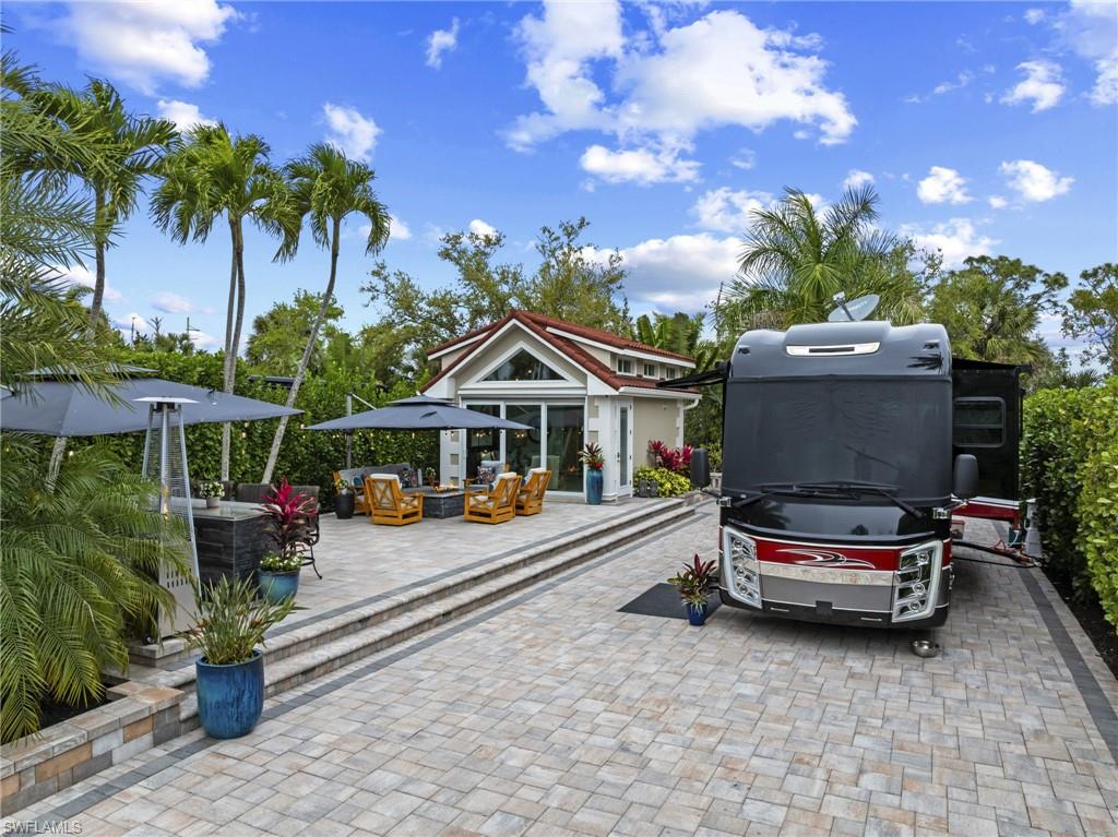 Experience the ultimate in luxury and convenience with this Class A Motorhome site at Pelican Lake Motorcoach Resort, one of the most prestigious motorcoach communities in the country. This exceptional lot features a fully equipped casita with a full kitchen, complete with quartz countertops and a beautiful backsplash, a full bathroom, a full-size washer and dryer, and a loft, providing a versatile and comfortable living space. The extralong, newly paved lot is beautifully landscaped, creating a stunning backdrop for spectacular outdoor living. A 120-gallon propane tank powers the tankless water heater, grill, and heat lamps, making the patio and yard perfect for entertaining, relaxing, or enjoying meals outdoors. Residents enjoy a vibrant lifestyle with access to a clubhouse, pickleball courts, exercise room, heated pool and spa, and a scenic lake ideal for kayaking and fishing, High-speed internet and landscape maintenance is included in the HOA quarterly fees. Situated between Marco Island and Naples, this Class A Motorhome site combines luxury, convenience, and unmatched outdoor living in one of the country’s premier motorcoach resorts.