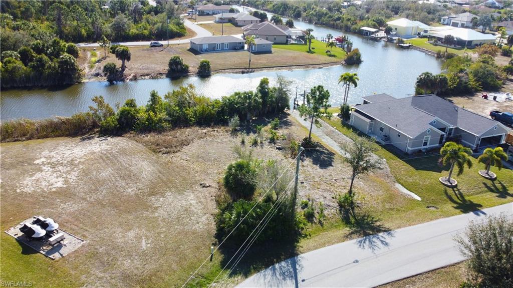 With neighboring homes already established, this is an ideal setting for your custom build, surrounded by residential growth and continued development in the area.

Enjoy tranquil canal views right from your backyard and the opportunity to create your own dock and outdoor oasis.

Conveniently positioned near everyday amenities, you’re just minutes from shopping and dining at Port Charlotte Town Center and close to outdoor recreation at Charlotte Harbor Preserve State Park.

Whether you're looking to build your primary residence, seasonal getaway, or investment property, this waterfront parcel delivers both value and vision in one of Southwest Florida’s steadily growing communities.