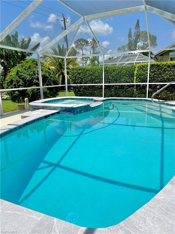 PET FRIENDLY seasonal rental. Available for the entire 2027 season! Spacious 3br/2ba 2 car garage pool house. Berkshire Lakes is conveniently located to shopping, banking, restaurants, downtown Naples, white sand beaches and I-75. Property features cathedral ceilings throughout, remodeled kitchen with granite counter tops, new laminate flooring throughout (no carpets!) recently painted inside and outside. Tastefully decorated with newer living room and dining room furniture. WESTERN exposure - enjoy sunsets from your screened lanai with pool. Short walk to clubhouse with a heated community pool, two har-tru tennis courts, jogging/bicycle path along two large lakes. Pool is not heated. Spa is not working.