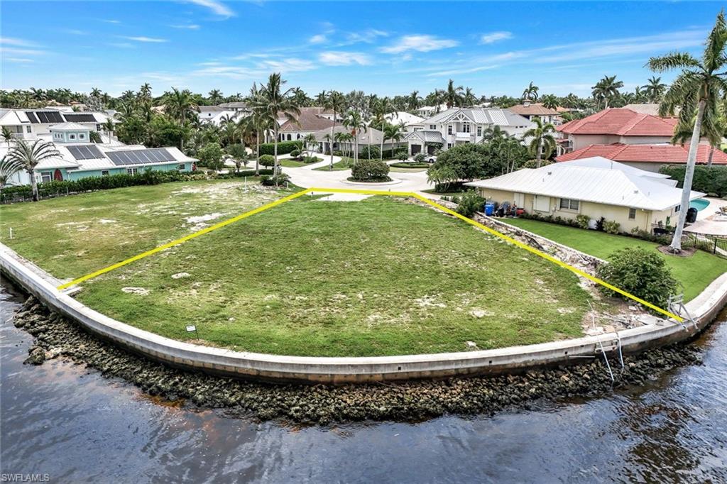 Positioned at the end of a quiet cul-de-sac in the exclusive neighborhood of Royal Harbor, this residential homesite is the perfect canvas to create your ultimate waterfront address. Impressive residential plans designed by award-winning Stofft Cooney Architects accompany offering. Exceptional panoramic views with easy access to Naples Bay and the Gulf of Mexico. Limitless dockage possibilities with 120’ of frontage on the Gordon River that can accommodate the largest of boats with ease. NW exposure assures many picture perfect sunsets on your own piece of Paradise in the heart of downtown. A short stroll or quick boat cruise carries you to 5th Avenue S and 3rd Street S to enjoy all that makes Old Naples one of the most desirable places in the world to call home.