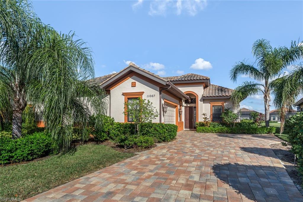 LAKEFRONT 3-Bed+Den/3-Bath Granada Villa in wonderfully upscale Esperanza at Paseo! Stunning spot-on direct lake & fountain views greet you from the moment you open the door! Fabulous model-quality home w/superb upgrades around every corner... plantation shutters thru-out, crown molding, neutral tile on the diagonal, wood floor in the den, high-end cabinetry, granite, stainless appliances, frameless showers and designer listellos. HUGE extended screened lanai w/electric roll-down Hurricane Shutters. Spotless move-in condition on this lakefront beauty that's guaranteed to impress! Priced under recent appraisal too! See the rest, then see the BEST!!