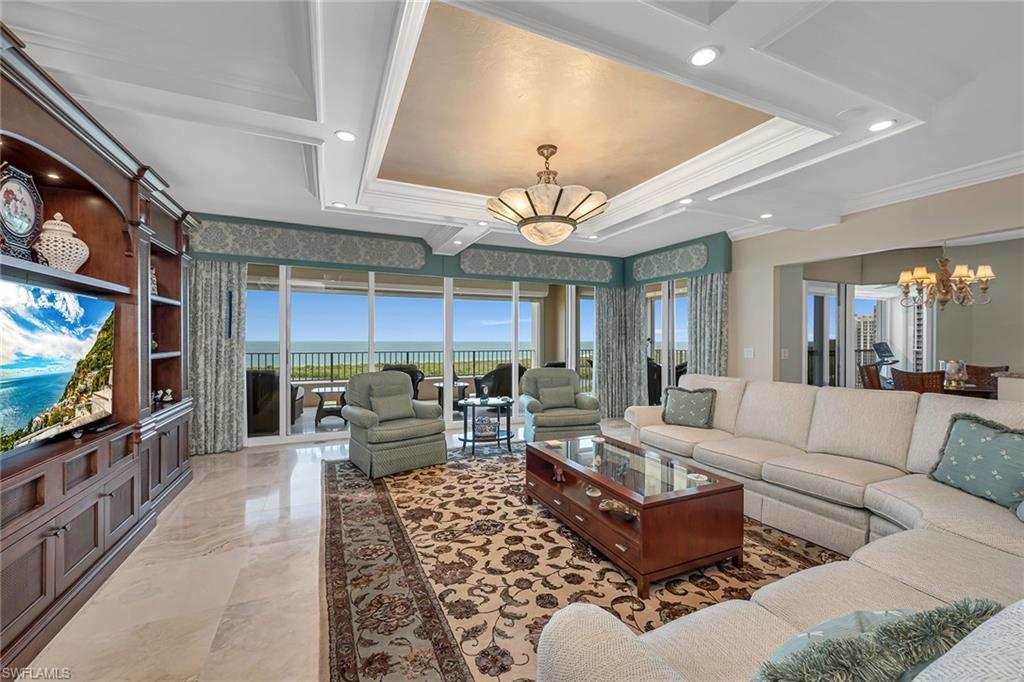 The one everyone is waiting for, over 4,500 square feet of indoor/outdoor living on the 17th floor in the coveted Cap Ferrat building. Gorgeous Gulf views, three balconies with 3,650 square feet under air, lives like a home, three bedrooms plus den and four baths. Entertain your guests in the large, open living room, kitchen, dining room and family room area with exquisite long-range views north and south of the Gulf of Mexico. The open kitchen features beautiful cabinetry, built-in appliances and granite countertops with a rare gas cooktop. Master suite with walk-in closet, walk-in shower and jetted tub overlooking the Gulf. Two car spaces and a community with 24-hour security and staffed gate and front desk, concierge service, fitness center, resort-style pool, spa, health club, saunas, steam rooms, massage rooms and so much more. Pelican Bay residents and guests have access to beach clubs with dining and community center with fitness center, spa and tennis courts.