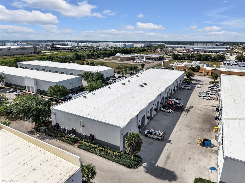 Industrial flex condominium available for sale or lease in the highly desirable Alico Road Business Park. This well-maintained business park offers excellent access to major transportation corridors including I-75 and US-41, and is just minutes from Southwest Florida International Airport, making it an ideal location for businesses serving the greater Fort Myers, Estero, and Bonita Springs markets. This nearly 2500 square foot unit features a functional office/warehouse layout designed to accommodate a variety of commercial uses including contractor offices, light manufacturing, service businesses, distribution, showroom, or general warehouse operations. The front portion of the space is built out with 2 private offices, a reception or showroom area, and a restroom, creating a polished environment for staff and visiting clients. A true move in ready blank slate for the next owner/tenant. The rear portion of the unit provides an open warehouse space with a 500sf mezzanine. The warehouse area within the building features high clear 24' ceiling heights, grade-level 13' overhead door access, and efficient open floor space that allows flexibility for a wide range of business operations. As mentioned this unit incorporates a mezzanine area to maximize usable capacity. The property is constructed of durable concrete block with a metal roof (2025) and benefits from modern utilities including electric, water, sewer, and telecommunications connectivity. Located within a professionally maintained industrial park, the property offers convenient parking and easy access for employees, customers, and service vehicles. The Alico corridor is one of Southwest Florida’s most active commercial hubs, surrounded by major distribution centers, corporate offices, and rapidly expanding residential communities. This property presents an excellent opportunity for both owner-users seeking a centrally located operational space and investors looking to acquire industrial flex product in a supply-constrained submarket with strong demand. The building's roof and painting were redone in 2025. Effective year built 2020 (Completely redone) - Original year built 2008.