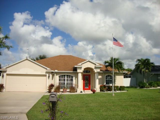 The Location is perfect! Paradise awaits you in this 3/2  plus den pool home surrounded by tropical landscaping located in a well-established highly desirable neighborhood in Cape Coral. The back lanai extends to the length of the home, providing ample outdoor space for relaxing and entertaining, and has decorative lanai pavers, as well as a pool bath leading to the interior of the home. Pool is a salt water system and is heated either electric or solar. Lots of beautiful landscaping with palms trees and vinyl fencing for privacy. Home has both electric & manual storm shutters, Generac generator, and AC is only 3 yrs. old. Laundry room with full size washer & dryer & laundry tub. Lots of cabinets and work bench in garage. City Water & Sewer are in and paid. Come & see this beautiful home it has a lot to offer at a great affordable price!! SELLER VERY MOTIVATED BRING OFFERS!!!!