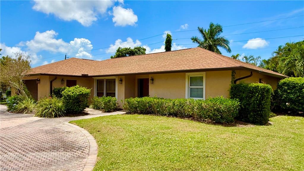 Beautifully remodeled home in Kings Lake which is a quiet neighborhood just ten minute to the beach. This is a dream home. Very private backyard with large paved pool area with palm trees. Wet bar with wine cooler in living room. Travertine tile flooring throughout the living area with bamboo wood floors in the bedrooms. Open kitchen with ceiling-high cabinets and granite countertops. Stainless appliances and recessed light. Build-in microwave, induction stove top. A lot of space with two living area, dining area. Huge master bedroom with large master bathroom. Master bedroom has direct pool access. Walk-in shower double vanity and walk-in closet. Two adjacent guest bedrooms, one with walk-in closet and the other with patio/pool access. Guest bathroom with shower/tub and patio/pool access. Plenty of space overall with a lot of cabinet space. Plantation Shutters. And extra storage in the garage with custom built cabinets. Upgraded and hurricane rated, garage door. There is a half bathroom and laundry room. Very spacious 2-car garage with cabinets. Newer pool heater and pool pump. This is a great home to live full time or as vacation home. It would make a great rental home as well with 12 allowed rentals per year (minimum one month). Kings Lake features tennis/pickleball. Public golf courses are nearby. Sold furnished//turnkey. Set up now with two kings beds and two twin beds. Annual HOA fee only $472.