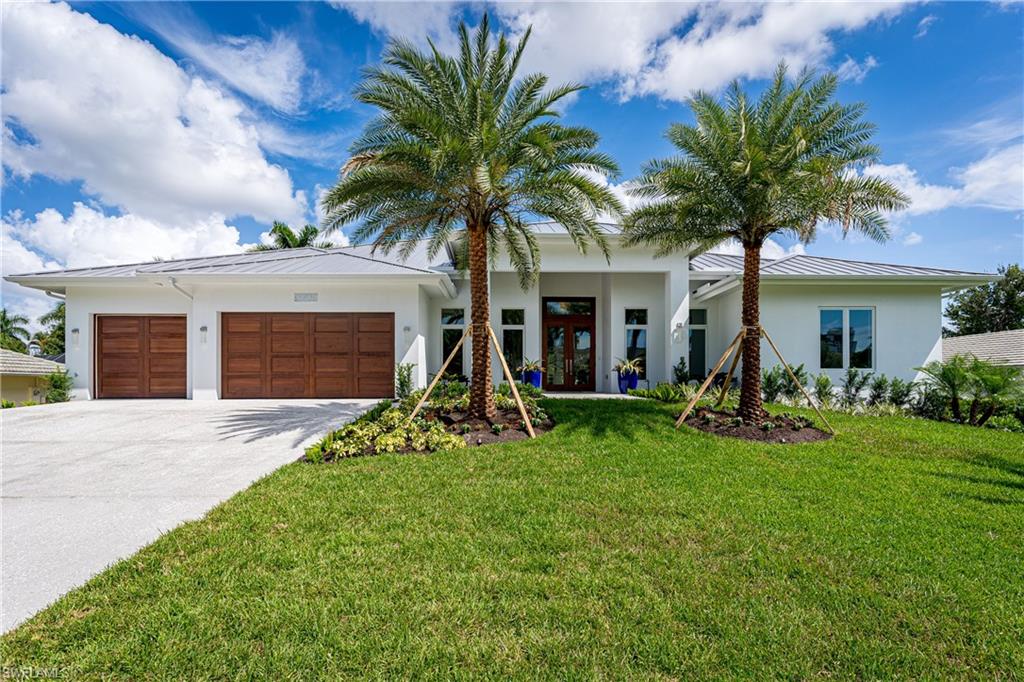 Be the first to live in this grand home in highly desirable Park Shore. Minutes to Olde Naples, Venetian Village and across from Naples Bay. Single Story, 4 Bedroom,  4 full/2 half baths with den. This clean contemporary design is a WOW with super wide plank European wood floors, single sheet porcelain bath floors exemplify the beauty of luxury living. Spacious and eye popping open living concept has an amazing large living room for your enjoyment. Exceptional kitchen of gourmet level WOLF SubZero appliances is ready for entertaining. Rare lap pool, semi covered spa with a great outdoor kitchen ready for your parties on deck. Super rare large slab shell stone decking is spectacular. This home is designed with minimal steps and features impact windows, doors and is built above flood plain for your peace of mind. Three car garage opens up from solid mahogany doors. Easy to use home lighting automation, WIFI enabled components give you the ability to enjoy your home while away.  This is your chance to join the lifestyle that is Naples.