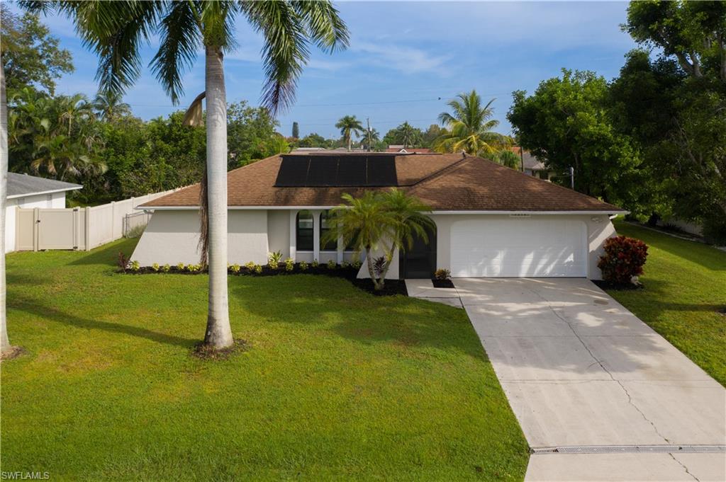 Picture perfect pool home in SE Cape ready to move into! This home was just beautifully renovated with gorgeous new kitchen, bathrooms, tile floors, paint and new impact windows!  Stunning kitchen with striking granite counters, white cabinetry, brand new stainless steel appliances including neat refrigerator with 4 door flex, pendant lighting & pantry.  Wonderful floor plan offering formal living room, formal dining room & nice family room.  Beautiful tile floors through out.  Split plan with nice master with walk in closet & french doors to lanai, master bath w/beautiful tiled shower & new vanity & toilet, two guest bedrooms on opposite side of home -both with walk in closets!  Pretty pool bath with new tub/tile & new vanity & toilet. Large inside laundry.  Spacious screened lanai - with good size under cover area as well as sunning area - solar heated pool. Fenced backyard & large shed!  New impact windows -- sliders & french doors are not impact. Wonderful quiet neighborhood with its own neighborhood park - quick access to Fort Myers as well. City water & sewer -all assessments  paid - sprinkler system too! Located in flood zone X so no flood ins required. Easy to call home!