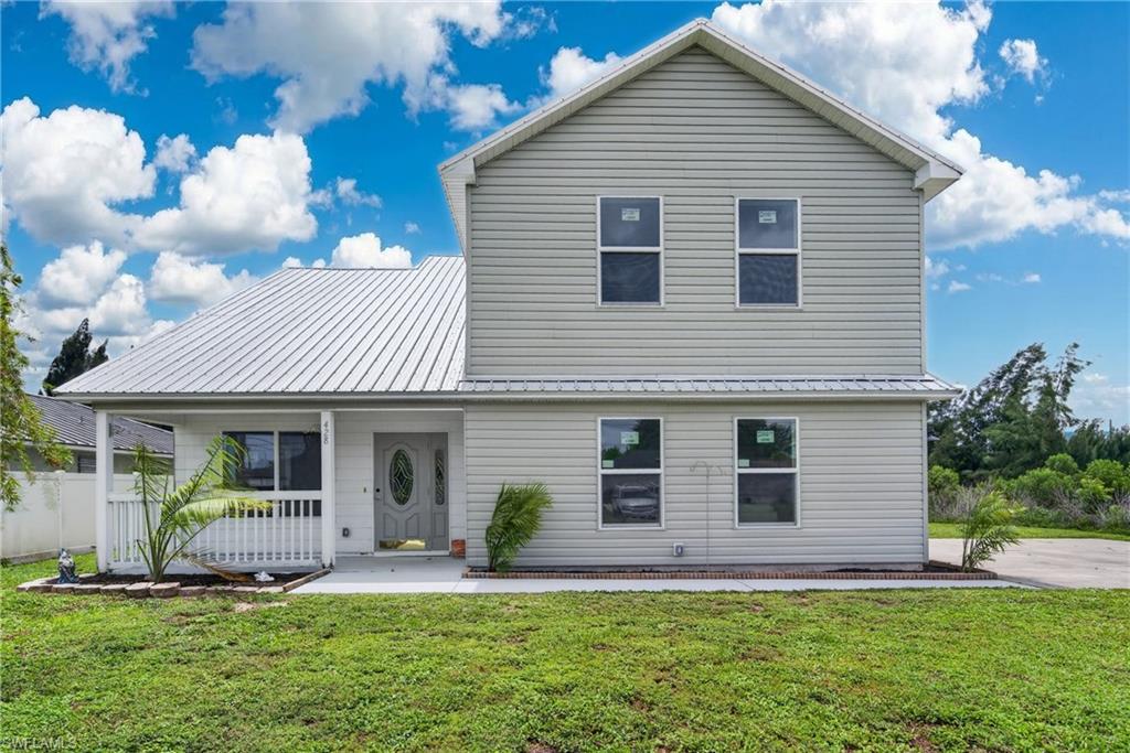 This beautifully renovated move in ready home offers 3 bedrooms, 2.5 bathrooms, and stylish updates from top to bottom. With soaring ceilings, an open-concept floor plan, and abundant natural light.

The stunning new kitchen is the centerpiece of the home, featuring contemporary cabinetry, new stainless steel appliances, updated flooring, and a large center island that’s perfect for gathering with family and friends. Upstairs, the spacious primary suite provides a private escape with a luxurious remodeled bathroom showcasing a relaxing soaking tub and an impressive waterfall shower. All three bathrooms have been thoughtfully updated with modern finishes.

Major improvements provide peace of mind, including a newer metal roof, new impact-resistant windows, and a new A/C system.

Step outside to enjoy the welcoming front porch or envision your dream backyard. The oversized yard offers plenty of room to add a pool, create an outdoor entertainment area, or store your boat.

A major advantage is city water and sewer—with all assessments fully paid—eliminating future assessment costs and adding significant value.

Ideally located just minutes from a Gulf access boat ramp, beautiful parks, shopping and restaurants along the Pine Island Rd corridor. This exceptional home delivers the perfect blend of modern updates, convenience, and plenty of space for the whole family