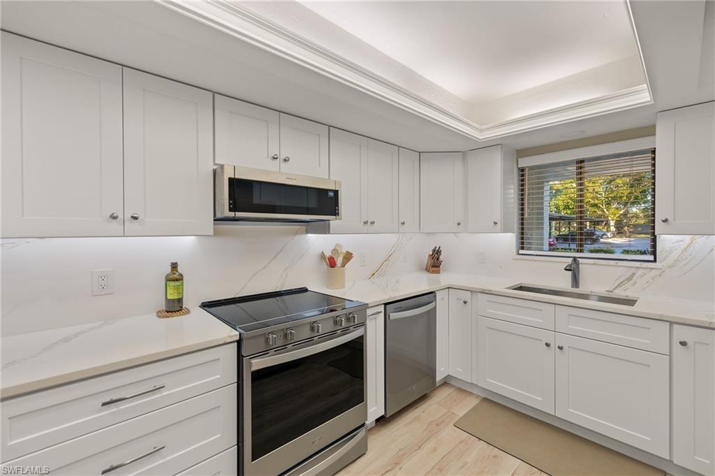 Wow!! This Windjammer condo is the one buyers wait for! Beautifully updated and move-in ready, this 2-bedroom, 2-bath first-floor residence combines comfort, style, and the incredible lifestyle that comes with living in The Landings Yacht, Golf & Tennis Club. Inside, you’ll love the open and spacious layout with gorgeous new wood-look luxury vinyl flooring throughout the entire condo. The kitchen has been completely refreshed with new cabinetry, stunning quartz countertops and backsplash, and stainless steel appliances that make the space feel bright, modern, and functional. Both bathrooms have also been thoughtfully updated featuring tiled walk-in showers, comfort-height vanities, and tasteful finishes that give the home a clean, coastal feel. Hurricane shutters provide added peace of mind, and the newer air conditioner adds value where it counts. One of the best parts? The easy first-floor walk-out access and the relaxing screened lanai overlooking peaceful water views of the pond and fountain. Offered furnished, this condo makes an easy seasonal getaway or full-time Florida home. Located just a short walk from many of the community amenities, this home is perfectly positioned within one of Fort Myers’ most sought-after gated communities. Residents of The Landings Yacht, Golf & Tennis Club enjoy an unmatched lifestyle with: A full-service marina with slips up to 60’ (if available), Unlimited golf, Tennis, Pickleball, Bocce ball, Fitness center, Daily activities and social events, and Two on-site restaurants one is waterfront! From the moment you drive through the guarded gate and see the lush, park-like grounds, you’ll understand why so many people love calling The Landings home.