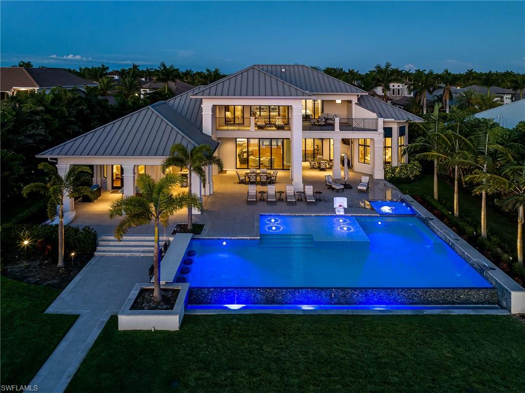 Unveiling a masterpiece of luxury and exclusivity in the prestigious Miromar Lakes community. This single-owner jewel, constructed in 2019, offers unparalleled sophistication and comfort, spread across nearly 6,000 sqft.
Five lavish bedrooms, a private study, and 6.5 elegantly appointed bathrooms define this grand residence. State-of-the-art appliances and a gourmet chef's kitchen create an ambiance of modern luxury. A beautiful simulated fireplace enhances the inviting main living area.
The exterior showcases exquisite craftsmanship with concrete block/stucco construction and a metal sheeting roof. The highlight is the infinity-edge pool and spa, providing unobstructed lake views. An expansive outdoor deck and private lakefront beach amplify the home's exclusivity.
Located on a spacious 0.64-acre lot, the residence is within reach of exclusive community amenities, the Miromar Outlets, the Florida Gulf Coast Town Center, and stunning Florida beaches.
Seize this unique opportunity to own an elegant piece of paradise. Schedule a private viewing today.