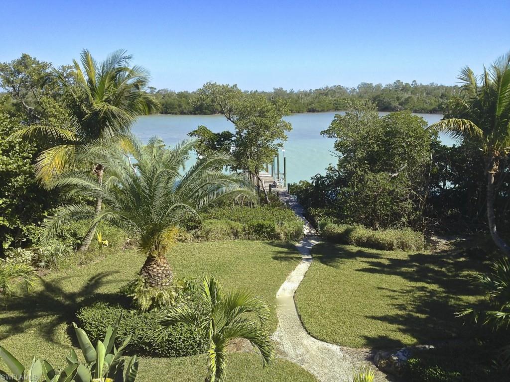 Magnificent estate overlooking widest section of Channel with story book guest home situated on 2.2 gated acres with royal palm drive + walsh lands. design. Deeded beach Acc w/golf cart path directly across drive. Main home features 4 bedrooms,5 1/2 baths, 3 stop elevator, solid wood doors, 3 fireplaces and wood paneled study. 28'l master, exercise room, + outdoor decks & porches. Main - pool, waterfall, summer kitchen, spa, covered dock + 2 lifts. Guest 4 b/r “southern living" plan added 2008 pool, gazebo. Wainscoting, transom windows, 10' ceilings,crown molding, 2050 sq' + 4 verandas. Both homes beautifully furnished. Incredible value!