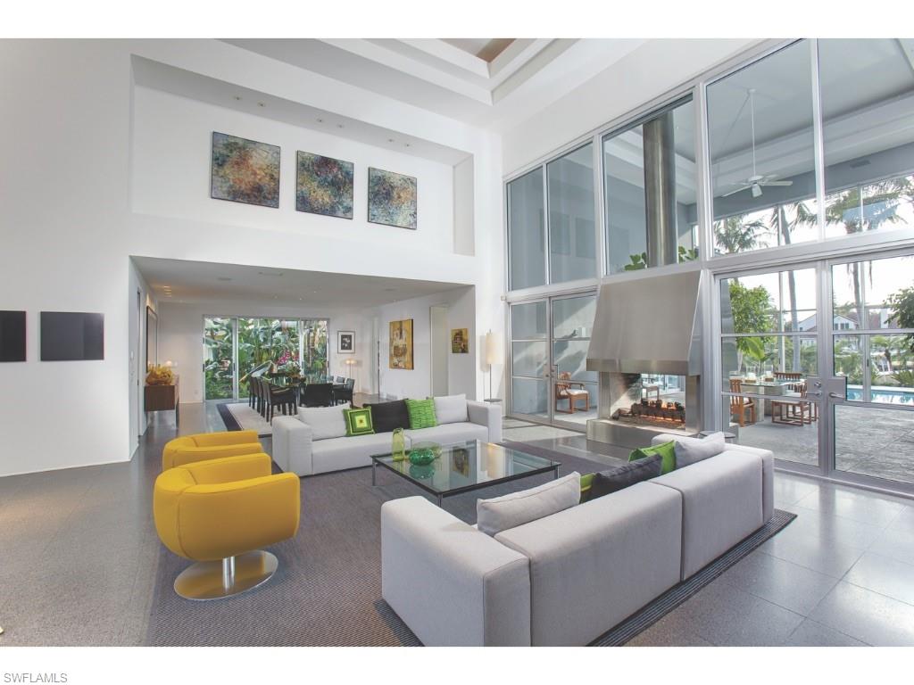 Contemporary, minimalistic, tranquil, comfortable, private, functional, and inspiring…These words articulate exactly what today’s buyers are searching for in a home.  Each characteristic, on its own, can often be used to describe one home or another in the area.  It is exceptionally rare, however, as is the case with 1350 Spyglass Lane, that they can all be used to describe the same home. The first floor consists of two bedrooms, both of which are currently utilized as offices, a family room, living room, dining room, chef’s kitchen, expansive outdoor lanai, wine cellar and three car garage. The second floor is completely separated into two very private wings; one for a massive master suite with beautiful water views. The other for two sumptuous guest accommodations with a large shared family room. Short sail to the Gulf of Mexico or the pastoral estuarine waterways. No bridges. Eligible for Port Royal Club membership. The Port Royal Club offers celebrated beachfront dining and significant tennis and fitness programs.