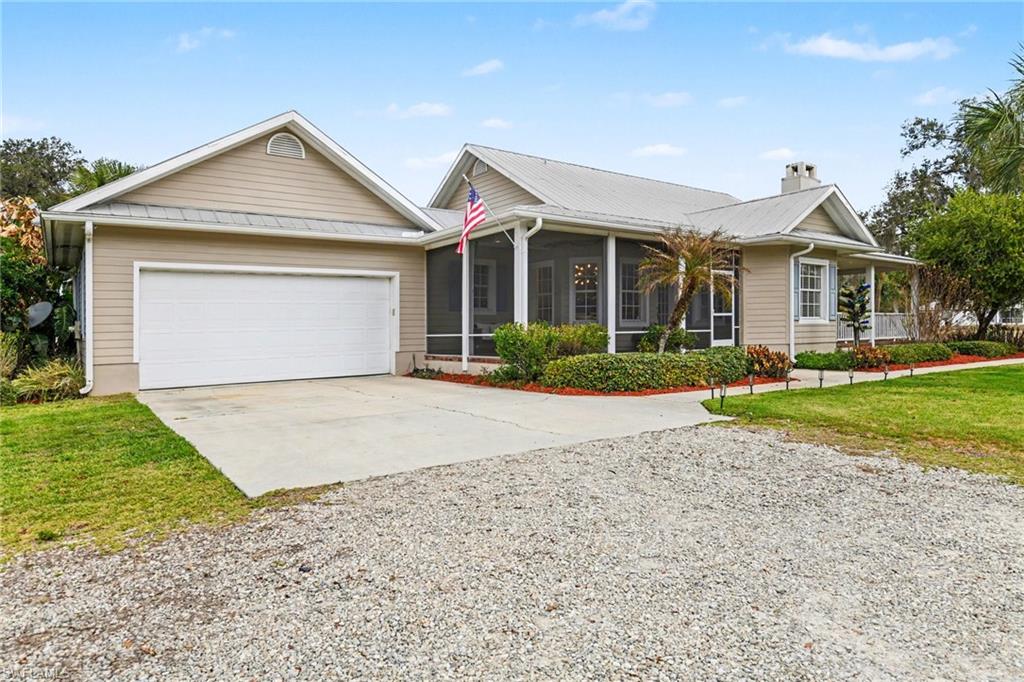 Fantastic 3 bedroom 2 bath 4 car garage gulf access home with air conditioned out building on just over 3.5 acres!! This property boasting more than 2000sf of living area has a beautiful kitchen with stainless steel appliances, large living area with fireplace, spacious master bedroom and bath, generous sized guest rooms, loads of outdoor living space on the multiple screened porches!! So many extras including, metal roof, lush landscaping, NOT IN A FLOOD ZONE, property is totally fenced, private gated community with only 4 properties behind the gate, BOAT DOCK AND LIFT on the Caloosahatchee river and so much more!!