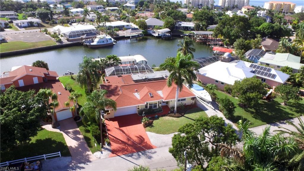 Fort Myers Beach Boaters Dream home. Considered the best and one of the highest subdivisions on the Island. Very deep water canal. 3 bedroom 3 bath, solar and/or Heat pump heated pool home, comes complete with 2 docks and 2 lifts. Nice Private home office / den. Master Bath and master walk in closet completely updated and enlarged 2016 . Tile throughout. Granite counters and granite Island with full stainless kitchen. Large crown molding in Kitchen, Living room and office. Large In house laundry room, could be 4th bedroom. Split floor plan with open living and dinning area. 4 minute walk to Beach. 4 minute boating to Estero Bay then on to Gulf. PGT Impact windows throughout except back sliders and skylights. Sold with 1 yr American Home Shield Protection Plan, provided by Listing Agent ($550 Value)