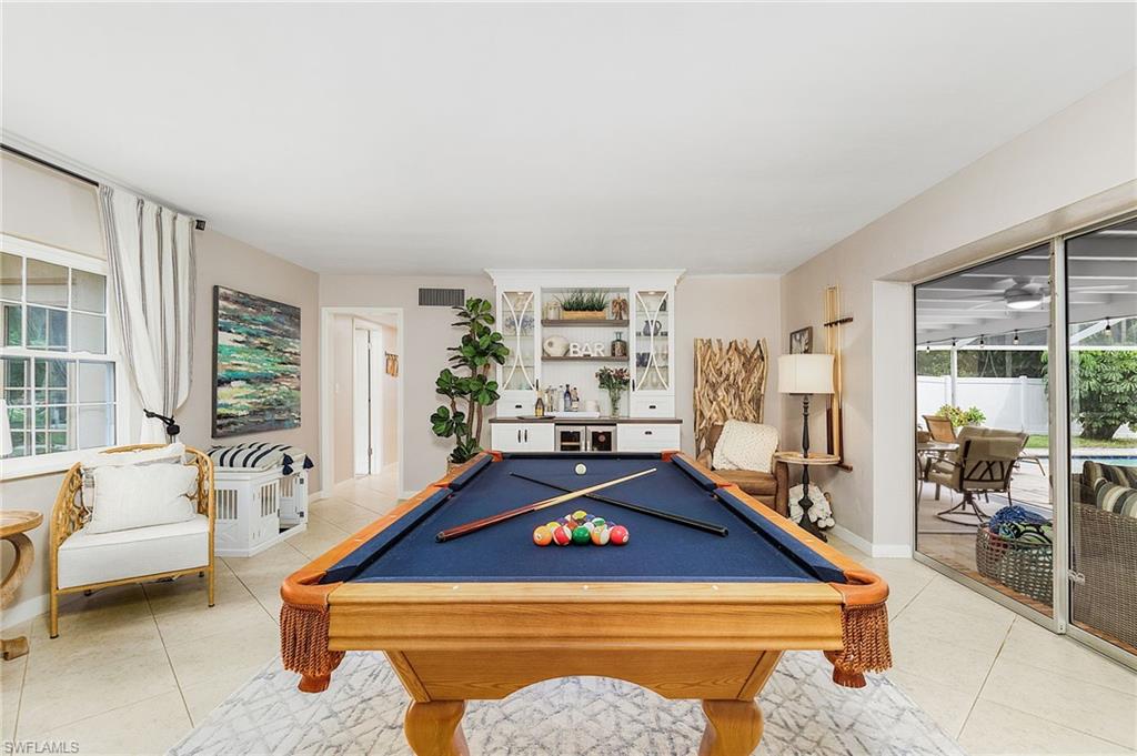 Welcome home to this mid-century Florida charmer located on the riverside of McGregor Blvd, surrounded by lush landscaping and peaceful privacy with newly fenced in backyard. Just minutes from downtown, shopping and dining. Everything you need is quite literally at your fingertips! This fully remodeled beauty boasts a number of fantastic upgrades including a new (2015) saltwater pool with multiple jets, Extra large covered Lanai, new roof in 2020 (with 10 year transferrable warranty), hot tub, new HVAC system/ducts in 2019 and new custom built wine bar in the game room. The rest of the home is also fully remodeled with beautiful 18' tile and wood floors.  Kitchen features, stone counter tops, breakfast nook overlooking the tropical front yard, quality wood cabinets with soft close doors & drawers, with pantry wall of cabinets, new light fixtures and can lighting and fans through the rest of the house as well. Way too many other upgrades to list here. You have to see this one for yourself. If you're looking for the perfect mix of unique mid century charm coupled with modern clean design...look no further. Schedule your private showing today before this gem is gone!
