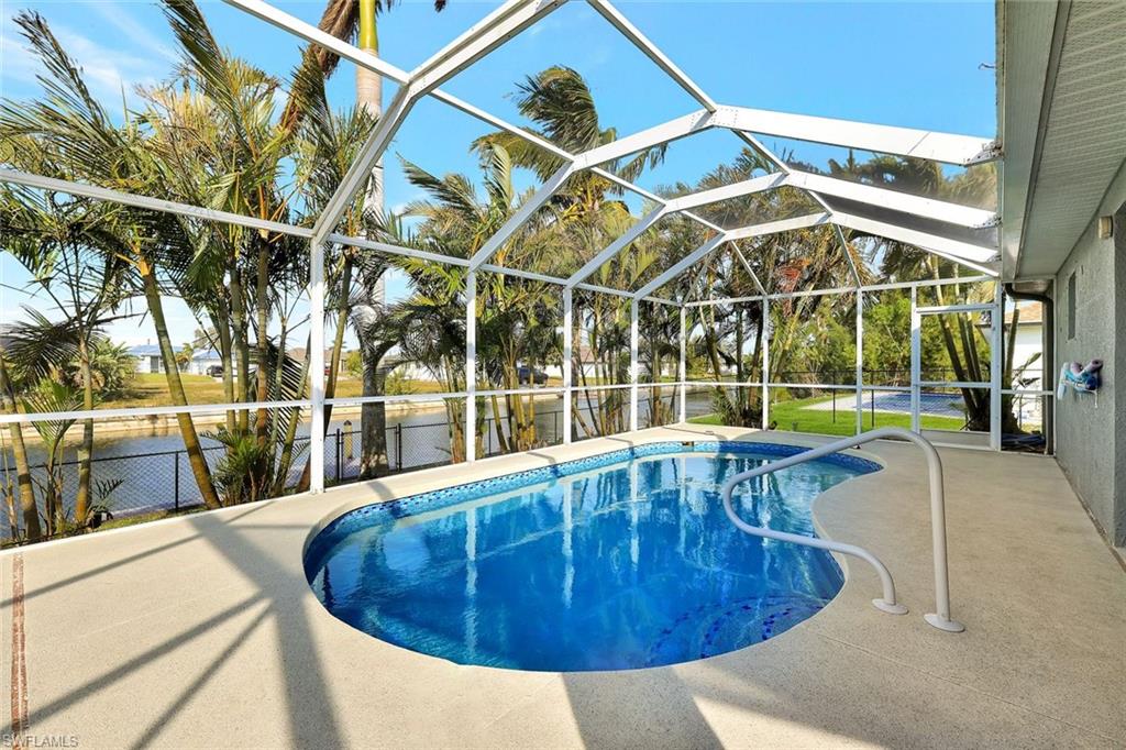 Welcome to paradise! Waterfront pool home with 4 bedrooms and 2 baths on a beautiful canal in SW Cape. Located in a quiet neighborhood with close proximity to restaurants, shopping, schools and easy access to Veterans Parkway. This home is ideal for investment, snowbird living, or a fresh start in town. Outside you will find a resurfaced heated pool, refinished lanai decking and driveway, fully fenced yard, a newly refurbished composite dock, new pool pump and heater, and a new roof (2023). The inside has been freshly painted, new tile flooring throughout, updated bathrooms, and 4 refreshed, furnished bedrooms. Enjoy comfort and peace of mind with the newer roof and location requiring no flood insurance. Don't miss this one - schedule a showing today!