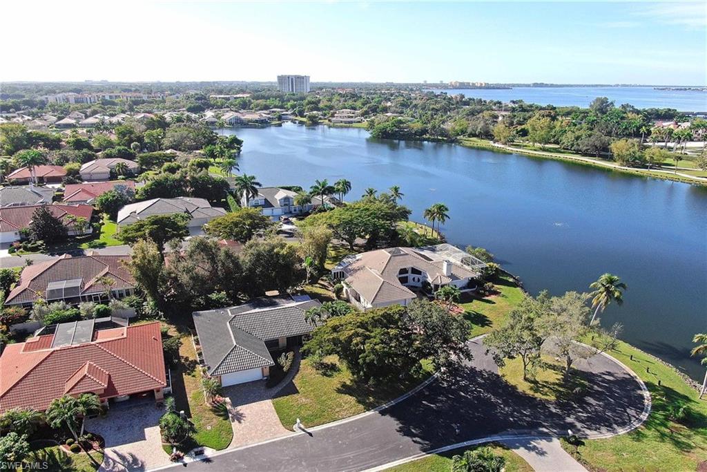 A quiet cul de sac location close to all the amenities in Caloosa Yacht and Racquet Club provides the setting for this 3 bedroom 2  bath home which is getting a BRAND NEW ROOF!  With a new tile roof and Kevlar storm screens, 2017 HVAC and new water heater, this  split bedroom ranch will be ready to add all your own finishing touches.  The 200+sf screen porch has been enclosed to function as a 4 season Florida room with a southern exposure, and the outdoor paver patio has a roll out sun shade.  Caloosa Yacht and Racquet Club has a great Olde Florida vibe.  Located on the River Side of the McGregor Corridor, it has a wonderful charm with its beautiful gated entry, extensive landscaping, river vistas, and lagoon.  Come and experience the lifestyle with the active racquet sports program, heated olympic-sized Pool, Deep Water Marina which provides direct access to the Intercoastal and GULF of Mexico, and the exceptional cuisine and atmosphere of the award winning Blue Coyote Restaurant. Grounds include private park w/walking path, & 20-acre freshwater lake for kayaking. BOAT SLIP leases available to residents for $3.50/ft!