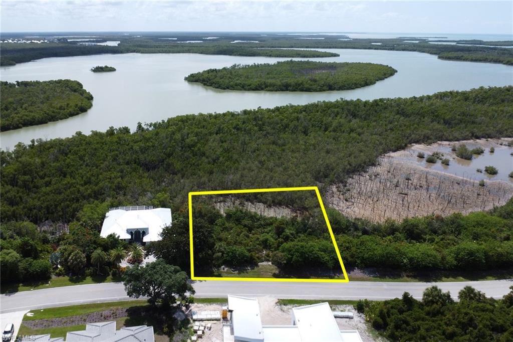 Build your dream estate in the prestigious gated community of Key Marco, one of Southwest Florida's most exclusive waterfront enclaves. This oversized 0.57-acre homesite offers exceptional privacy surrounded by pristine preserves, mangroves, and breathtaking natural beauty. Located within a 546-acre private island community featuring only 134 homesites, Key Marco provides a rare opportunity to enjoy luxury living in a tranquil, low-density setting.

The seller has invested tens of thousands of dollars in professionally prepared building plans and design work, which can be transferred to the buyer—providing significant value, saving time, and helping streamline future construction or expansion plans.

Residents enjoy access to a private marina with Gulf access, clubhouse, fitness center, tennis and pickleball courts, scenic walking and biking trails, and some of the finest boating, fishing, kayaking, and wildlife viewing in Southwest Florida. Underground utilities, central water and sewer are available, making this an ideal location to build your custom dream home.

Just minutes from Marco Island's world-famous beaches, shopping, dining, and entertainment, this exceptional homesite combines the privacy of a nature preserve with the convenience of island living. Don't miss the opportunity to own a piece of paradise in the highly sought-after Key Marco community.