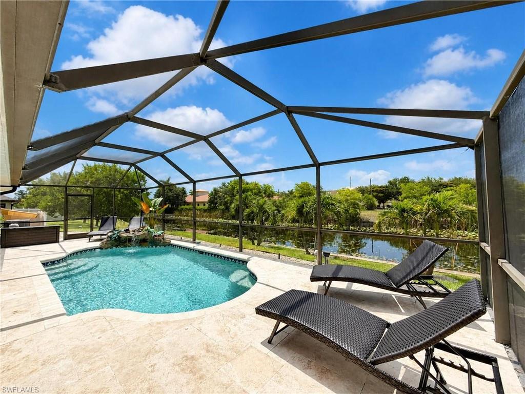 JUST LISTED   SW Cape Coral Waterfront Paradise Awaits — Stunning Pool Home on a Freshwater Canal

Step into your private oasis! This exceptional 3/2/2 waterfront retreat offers 4,000 total sf of sun-soaked Florida living (1,919 sq ft under air) on a picturesque freshwater canal. From the moment you arrive, soaring open-concept spaces, designer finishes, and effortless indoor-outdoor flow set this home apart. Whether you're entertaining in the chef-inspired kitchen, unwinding beside the cascading waterfall pool, or casting a line right from your own backyard, this home was made for living beautifully. An Entertainer's Dream, Open-Concept Living with a Sprawling great rm that flows effortlessly into your stylish formal dining area, perfect for gatherings large & small.  Show-stopping kitchen island with stainless sink w/bar-stool dining or serving up hors d'oeuvres. Sleek stainless steel appliances that make cooking a pleasure. Custom all-wood, soft-close cabinets and drawers throughout, quality craftsmanship in every detail.  Elegant granite countertops add timeless sophistication. Disappearing walls of glass open the living space directly to the lanai and pool, combining your indoor and outside. Rich travertine tile flows through every living area, the master bedroom, and both baths for a seamless upscale feel. Plush, soft carpeting for comfort in the secondary bedrooms. Inside laundry room Expansive master suite overlooking pool/canal w/huge walk-in closet. Spa-inspired primary bath w/double vanity & oversized walk-in shower. Handy pool bath keeps wet feet out of the main living areas. Move-In Ready with Major Upgrades Already Done, Brand-new roof (2022) one less thing to worry about, New air conditioner (2023) for worry-free comfort, Whole-house water softener for silky-soft water,  Reverse osmosis (RO) system for pure, great-tasting water.  Whole-house air cleaner for a healthier home, Automated AC drain line cleaner, smart, low-maintenance peace of mind.  Whole-house backup generator (available separately) keeps lights on no matter what.  Your Own Backyard Paradise...Sparkling heated pool with a soothing cascading waterfall, overlooking canal provides relaxation.  Child-safety pool fence for added peace of mind. Lush, professionally designed landscaping w/ auto sprinklers and lighting sets a magical evening mood. Elegant low-voltage landscape lighting highlights the outdoor beauty after dark. Seawall-protected freshwater canal frontage — grab your rod and reel, because the fishing (and fun) starts right in your backyard

More Thoughtful Extras Throughout ? Custom plantation shutters add classic charm and privacy. Full security system for added confidence.  Smart garage door opener with battery backup gives modern convenience you can rely on.
 
This canal-front gem offers the ultimate blend of luxury, comfort, and Florida waterfront lifestyle. Homes like this don't come along often — schedule your private showing today before it's gone!