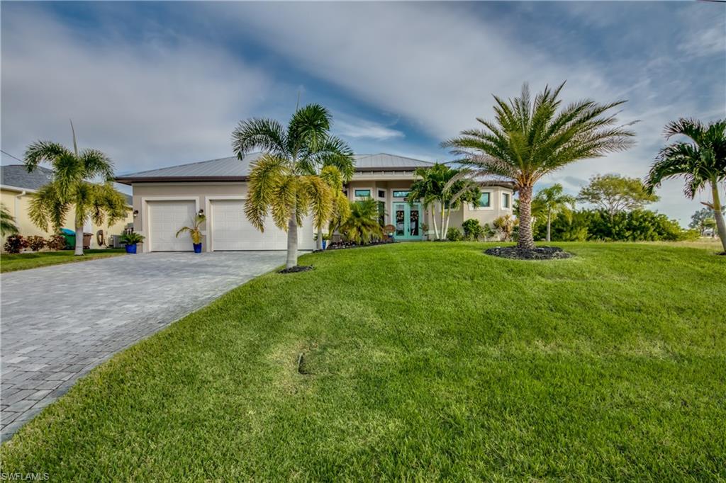 Better than new Gulf Access home with vanishing edge pool, composite decking dock with covered 8000lb boat lift, 3 car garage, paver drive, and whole home RO system. Interior features include upgraded granite countertops, wood cabinets in kitchen and bathrooms, travertine French pattern tile flooring throughout the home, 90 degree sliders, large office/den, and double tray ceilings with extensive crown molding. Luxurious primary suite with double walk in closets, walkthrough shower, and separate soaker tub. Enjoy the beautiful outdoor lanai and pavered pool area that includes a complete outdoor kitchen. SALT WATER POOL is HEATED for year round enjoyment. Home comes FURNISHED as an additional BONUS. This is a must see NW Cape Gulf Access home.