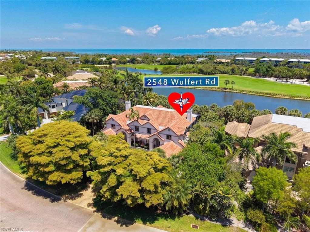 Wake up each morning to panoramic sunrise views and enjoy the serene setting this exceptional home provides. Located inThe Sanctuary—one of the Islands’ premier communities—this residence offers stunning lake views complemented by lush fairway sceneryalong the 17th hole. From the moment you enter, soaring ceilings and expansive windows fill the home with natural light, creating a bright,airy ambiance while framing views of the private pool, spa, and lush tropical landscaping. The open living spaces flow seamlessly into anexpansive outdoor entertainment area—perfect for relaxing or hosting guests. Inside, the home features a spacious great room with afireplace, a formal dining area, and a thoughtfully designed kitchen with a breakfast bar and excellent functionality. The four-bedroom floorplan includes three ensuite baths and an additional powder room, offering both comfort and privacy for residents and guests alike.Extensively updated and complemented by bright, coastal-inspired finishes, the home creates an inviting atmosphere ideal for a seasonalretreat or full-time living. Overlooking a picturesque lake that attracts local wildlife and a variety of bird species, the setting is both peacefuland visually captivating. Recognized as one of the best values in The Sanctuary, this property combines space, luxury, and low-maintenanceliving. Located within Sanibel’s prestigious golf community, residents also enjoy convenient access to Bowman’s Beach—renowned for itsshelling, sandy shores, and kayaking—just minutes away. Elevator shaft in place.