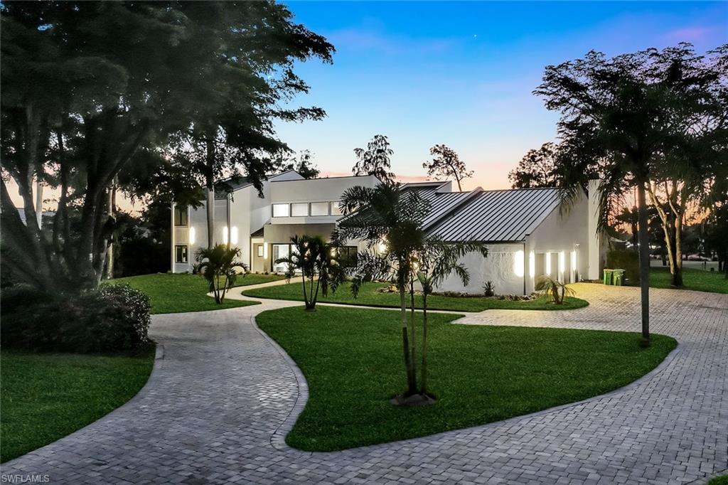 NO WAITLIST FOR GOLF OR SOCIAL MEMBERSHIP! NEW ROOF AND IMPACT WINDOWS PLUS have been upgraded in this home! Welcome to 13087 Pond Apple Drive, a stunning, fully renovated estate in the prestigious Quail Creek community of Naples. Nestled on an oversized 1.06-acre lot, this contemporary residence offers the perfect blend of modern sophistication and relaxed Florida luxury, with sweeping golf course and sunset views.

Step inside to find an impressive open layout highlighted by soaring ceilings, marble floors, and abundant natural light. The formal living and dining rooms set the tone for elegant entertaining, while the chef’s kitchen takes center stage with custom cabinetry, Thermador appliances, and a massive leathered quartz island. The adjoining family room flows seamlessly through pocketing glass doors to the outdoor living space, creating a true indoor-outdoor retreat.

Outside, a resort-style lanai invites you to relax and unwind with a heated saltwater pool and spa, a gas fire pit, and generous deck space overlooking the fairway — the perfect backdrop for both quiet evenings and lively gatherings.

The primary suite is a private sanctuary featuring white oak flooring, dual walk-in closets, and a spa-inspired bathroom with a freestanding soaking tub, quartz vanities, and dual rain shower heads. Three additional guest bedrooms, each with tranquil views, provide ample space for family or visitors, while the den offers flexibility for a home office, media room, or library.

Additional highlights include a three-car garage, circular driveway, impact-resistant windows and doors, a metal roof, and sleek, modern finishes throughout. Residents of Quail Creek enjoy access to two walkable 18-hole golf courses, a full clubhouse with dining, fitness center, tennis, and more — all within a secure, gated community just minutes from Naples’ beaches, shopping, and fine dining.

This exceptional property combines timeless design, privacy, and resort-style living in one of Naples’ most sought-after communities.