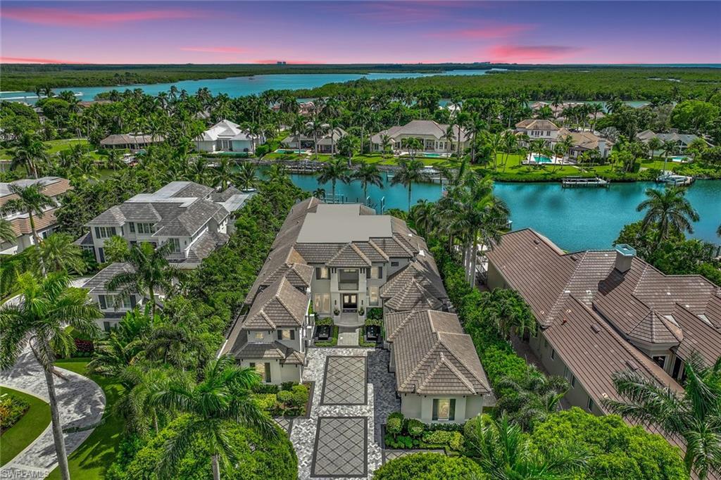 Meticulous attention to design and detail Port Royal Community estate. Seamless inviting confluence from indoor to outdoor spaces for entertaining and resort style relaxation.  Wine cellar,  first floor primary with smart technology glass, outdoor barbeque kitchen, infinity edge pool and spa, elevator, integrated Lutron smart home audio and visual, 3 observatory balconies, mini putt putt, car enthusiast 8 car design garage, fountain water pads, lush private landscaping, boat dock with lift and direct gulf access. Naples finest address with exquisite bespoke finishes throughout. Sale price reflects items conveyed with home.