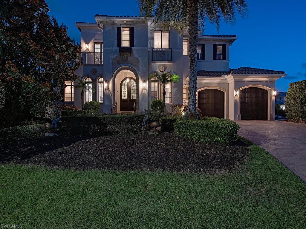 Nestled on the tranquil shores of Naples Bay, this exquisite waterfront property offers a harmonious blend of sophistication and serene living. Boasting a cul-de-sac lot with meticulous landscape and a private dock, this home is a haven for those seeking an exclusive retreat.
Step into the beautiful foyer and see soaring ceilings, dark wood trim matched with light Italian porcelain tile and wide planked wood floors which set the tone for this architecturally stunning home.
This home features a 700 plus bottle climate-controlled wine cellar and a tasting room. A chef’s delight, the state-of-the-art kitchen features top-of-the-line appliances, custom cabinetry, and a spacious island perfect for entertaining.
Watch the boats go by from the great room floor to ceiling windows, the view can also be enjoyed from the indoor and outdoor dining areas.
Retreat to your first-floor spa like master suite with water views and a private outdoor entrance. Upstairs the remainder of the bedrooms and baths, wet bar, loft area and a family room. Your family and guests have their own space upstairs including three bedrooms and baths, loft area, wet bar and a screened terrace with Naples Bay views! The lanai is set with oversized travertine tile, a beautiful outdoor kitchen and entertaining space. and pool with spa. Accompanied by your own private dock that can accommodate large vessels with direct access to the Gulf of Mexico, no bridges! Lock and leave, this home has CAT5 windows & doors and whole house generator.  This house is a hidden gem.