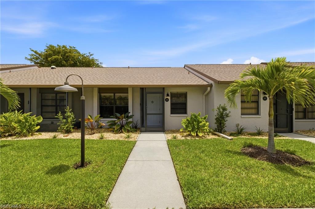 WELCOME TO PARADISE! This stunning 2-bedroom, 2-bath villa-style condo has been completely remodeled! From the moment you step inside, you'll appreciate the quality upgrades and attention to detail throughout. The beautifully updated kitchen features NEW granite countertops, NEW custom cabinetry, and modern finishes, while the spacious living areas showcase NEW plank tile flooring throughout. Both bathrooms have been tastefully updated, including a gorgeous NEW tiled walk-in shower. Additional upgrades include a NEW Culligan water system, NEW security cameras with doorbell camera, NEW remote-controlled hurricane shutters, and a NEW paved patio overlooking the beautifully landscaped courtyard. Enjoy the convenience of an assigned covered carport with a private storage unit, plus peace of mind knowing the building features a newer roof (just 2 years old) and updated landscaping. One of the community's four heated pools is located just steps from your front door. The real showstopper is the incredible value offered by the LOW HOA fee of only $450 per month, which includes flood insurance on the unit, exterior building maintenance, and access to an impressive lineup of resort-style amenities. Residents enjoy a beautiful clubhouse, four heated pools, tennis courts, pickleball, shuffleboard, billiards, an activities director, and a vibrant social calendar. Plus-a dog park for your fur baby, is just 5 minutes away! Located in a gated community with no age restrictions, this exceptional property is just a short bike ride from Fort Myers Beach and the Sanibel Causeway, putting world-class beaches, dining, shopping, and entertainment within easy reach. Whether you're searching for a full-time residence, seasonal retreat, or investment opportunity, this beautifully updated condo offers the perfect blend of luxury, convenience, and Florida lifestyle.