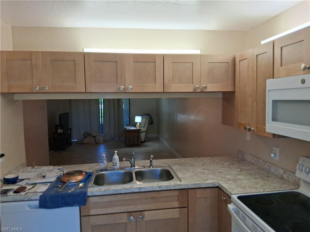 Welcome to this first floor(NO STEPS) two bedroom two bath condo LAKE VIEW in the highly acclaimed Foxmoor Village**Newer luxury ceramic tile throughout the main living areas**Recently renovated kitchen with Solid Surface countertops**This well maintained home includes roll down Hurricane Shutters, updated Plumbing, New Ceramic Tile flooring, and a newer Water Heater**Relax on your lanai with peaceful Lake and Preserve views**Just a short walk to the HEATED POOL and clubhouse offering Pickleball, Tennis courts, and Shuffleboard**Looking for a sense of community? Arbor Lakes is a fun and friendly neighborhood**Transferable interior "contents only" flood insurance**Leasing is allowed and one pet under 40 pounds is welcome**Meticulously kept and move-in ready for its next owner, with low and affordable monthly fees**Surprisingly, this community offers a little known hidden GEM: a nearby Gulf Access Canal within walking distance where residents may keep a boat for approximately $600 per year (subject to availability and a current wait list.) Enjoy the beautiful scenery along the boardwalk winding through mangroves and protected preserve areas-perfect for morning walks and nature lovers.
