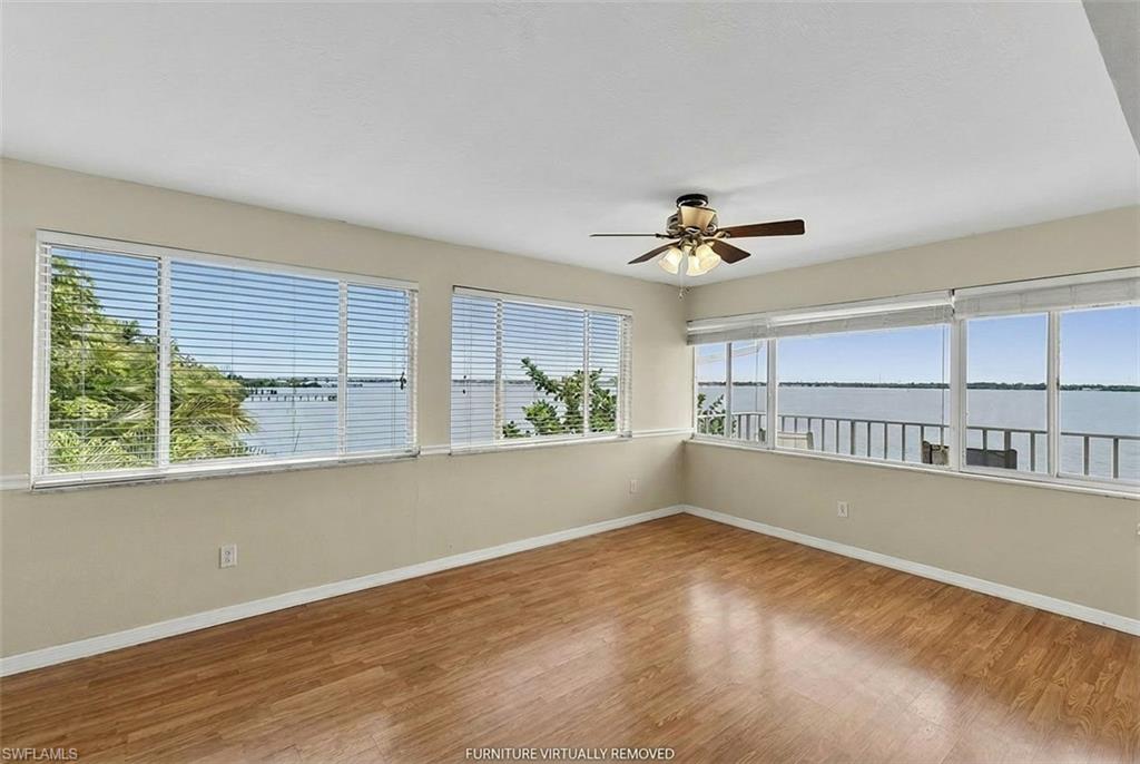 Third floor unit directly on the Caloosahatchee River with broad, unobstructed water views. One assigned carport and a private storage room.

The view is the whole story. Third floor means you're looking out across open water, not at your neighbor's lanai. Sunrise hits the river in a way that makes every morning feel like Saturday. Boats pass heading toward the Gulf. Dolphins show up when you least expect them. Manatees drift through in the warmer months.

Three bedrooms directly on the river is an unusual find. Two bedroom waterfront units are everywhere. Three gives you room to breathe without sacrificing the thing you actually came for. The carport and storage room are quiet conveniences you'll appreciate more than you'd think.

Fort Myers fills in whatever else you need. Downtown restaurants and bars, spring training baseball, beaches a short drive away. The Caloosahatchee connects straight to the Gulf for anyone who boats or fishes.