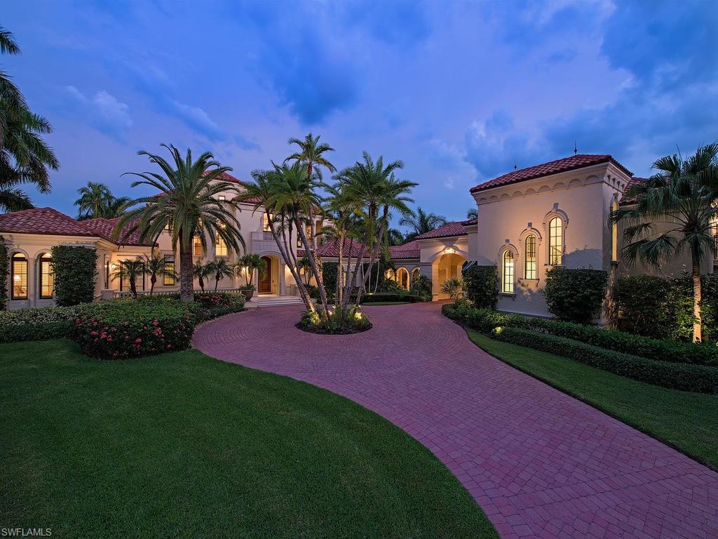 H.11152 - This is an impressive custom estate home ideally situated at the cul-de-sac at the end of Green Dolphin Lane with easy Gulf access through Old Harbour Channel.  Elegantly refined and magnificently appointed throughout its 10,064 Sq.ft. under air, this 8-bedroom landmark estate will be sure to impress.  Beyond the beautiful gated entry lies an idyllic oasis surrounded by lush tropical foliage.  Upon entry lies soaring ceilings, open living spaces and big picture windows giving a light and bright interior feel.  Features include beautiful wood floors throughout, custom coffered ceilings, gas fireplace, guest house, gourmet kitchen, 4-bay garage (room for 6 with lifts) and much more.  Gourmet kitchen includes an 8-burner gas French LaCanche Range, Carrera marble countertops, beautiful custom cabinetry, large pantry and large island with farmhouse sink and built-in wood block.  Guest house includes two bedrooms + office, bath and full kitchen.  The lush exterior boasts exceptional entertainment spaces with an oversized screened lanai, outdoor kitchen and custom pool/spa overlooking the Old Harbour Channel. Immediate eligibility to the Port Royal Club.