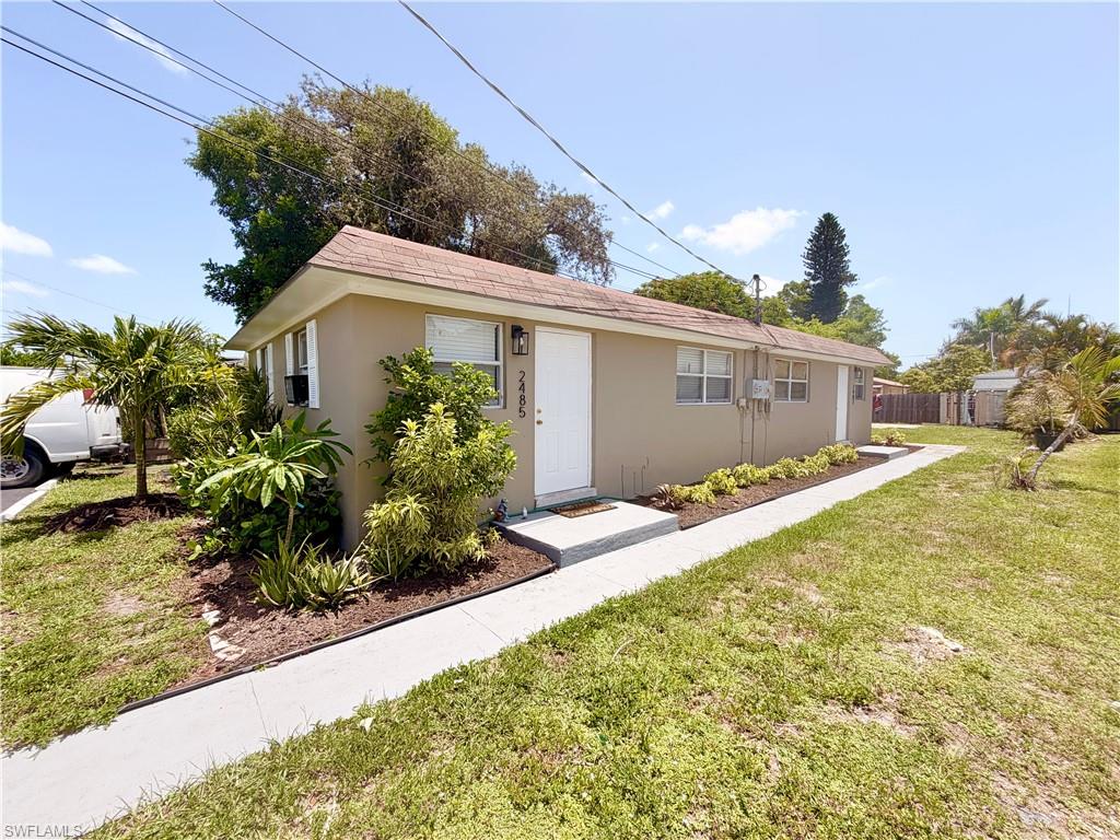 One or more photo(s) has been virtually staged, AI generated or rendered.  Amazing value near Bayshore Drive and the East Trail. This concrete block duplex offers a solid turnkey investment opportunity with both units fully occupied and leases already in place. Each unit features 2 bedrooms, 1 bathroom, and a rear patio, with several interior updates completed over time including flooring, kitchens, and bathrooms. Both tenants have been in place for 7+ years, offering immediate rental income from day one. The property also features a massive backyard that is partially fenced and includes fruit trees, creating additional outdoor appeal for tenants. Located just minutes from Bayshore Drive, downtown Naples, shopping, dining, I-75, and the many new developments taking place in the surrounding area, this property offers excellent proximity to some of Naples’ most active growth corridors.