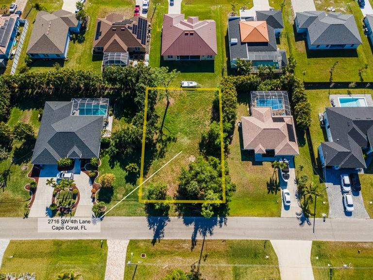 Available now in highly desirable SW Cape Coral! This premium homesite offers standard lot dimensions with city water, sewer, and irrigation available, making it ideal for a custom build or investment opportunity. Located in a rapidly developing neighborhood surrounded by newer homes, this property provides both convenience and long-term value. Enjoy quick access to Pine Island Road, featuring upscale shopping, dining, and everyday essentials, along with nearby elementary and middle charter schools. Boating enthusiasts will appreciate being just minutes from a public boat ramp with Gulf access, while golfers are close to Coral Oaks Golf Course. The property is also a short drive to the future 7 Islands development, planned to include waterfront restaurants, entertainment, and retail. With only two buildable lots remaining on this street, opportunities like this are becoming increasingly rare. Whether you’re a builder looking for a spec project or a homeowner seeking space, location, and value, this is a smart investment as prices continue to rise. Buyer to assume assessment balance.