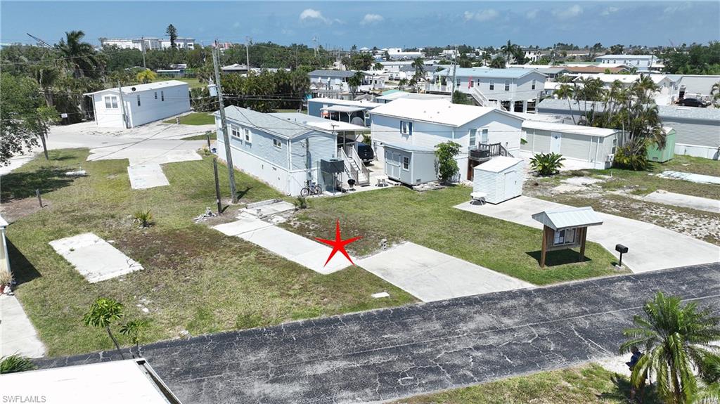 Vacant Manufactured Home Lot – San Carlos Island, Fort Myers Beach. Only $49,900 – 55+ Pet-Friendly Community. Affordable island living just minutes from Times Square, beaches, restaurants, and all the best of Fort Myers Beach. This vacant manufactured home lot sits in a welcoming 55+ community that’s both pet and golf cart friendly and perfectly located for easy coastal living. A low $95 monthly fee covers water, sewer, and garbage, making this one of the best-value opportunities in the area.  Have a boat?  A new boat dock for the community is being built soon. Or store your boat at Salty Sam's Marina- almost across the street. No boat? Freedom Boat Club is 100 yards away.  Dockside dining and the world-famous Pieces of Eight Pirate Cruise onboard a 65 ft. replica Spanish Galleon is a hop skip and a jump away.  And if you want to zip down to Key West walk over and jump on the Key West Express, a high speed 170 ft. long jet boat that will get you there in no time. Come live the island lifestyle without blowing all your doubloons!