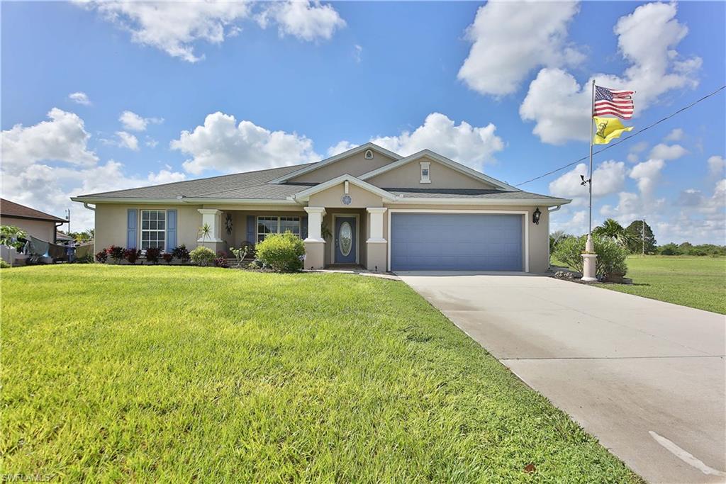 Take a look at this 3 bedroom 2 bath plus den home in Lehigh Acres! This home is in pristine condition! There is 18" tile throughout this 1969 Sq Ft home and updates all around. The kitchen has Corian counters with tiled backsplash and like new appliances. Large tiled Lanai with an entrance from the Master Suite or Living Area which overlooks gorgeous landscaping. Impact resistant windows and a new septic system that was installed in January 2017. This home won't last long! More pictures coming soon!