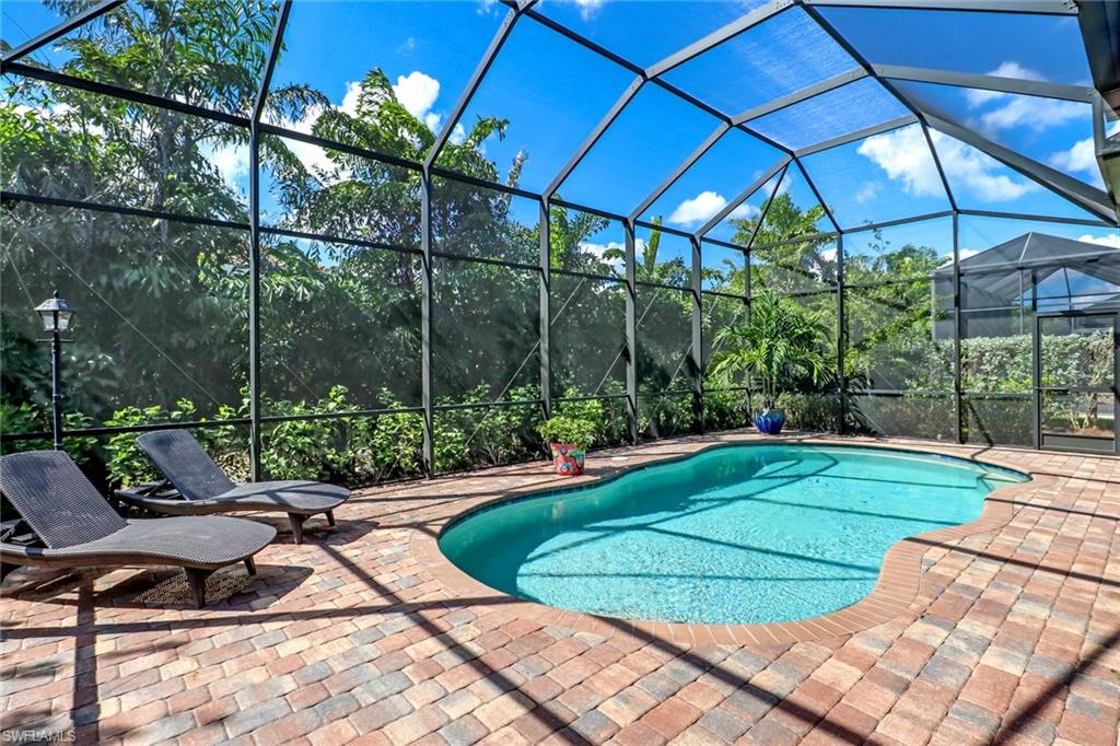 Impeccable quality and stunning finishes await at this beautifully built Stock home. This popular San Remo III floor plan features real hardwood flooring throughout all main areas and bedrooms, and french travertine tile in the bathrooms. Entertaining two or twenty is made easy in the chef's kitchen with oversized island open to the impressive great room with 12 foot tray ceilings. Stainless steel appliances (New Refrigerator), granite countertops and a full size walk-in pantry complete the space. A wall of sliders and picture windows welcome you to the paver pool deck with additional covered space upgraded by the builder and nestled in a tranquil, private setting with mature landscaping and preferred western exposure. The extended garage features an additional 6 feet of space and epoxy floor. AC recently replaced with UV light upgrade and carbon monoxide detector. Secoya Reserve is a small gated community of just 57 homes with low HOAs in an ideal location in North Naples - 10 minutes to the beach and surrounded by popular dining and shops. Walk to North Naples Middle School - A Rated School District!!