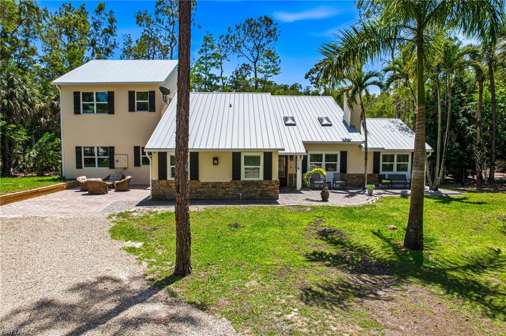 PRICE REDUCED! Exceptional investment opportunity in the heart of Naples offering tremendous income potential and unmatched versatility. This fully renovated, state-of-the-art estate features 10 bedrooms, 6 bathrooms, 3 kitchens, and accommodations for up to 26 guests, making it ideally suited for a large-scale vacation rental, corporate retreat, wellness destination, or private family compound.

Privately tucked away within the prestigious Collier Woods community, the property is accessed by a winding 400-foot driveway and surrounded by mature tropical landscaping for ultimate privacy and seclusion. Designed for entertaining and resort-style living, the outdoor spaces include a sparkling pool, multiple brick paver patios, a fire pit gathering area, and professionally illuminated landscaping that creates a stunning ambiance day and night.

Inside, soaring cathedral ceilings and expansive living areas provide an open, inviting atmosphere. A newer addition features 11-foot ceilings, hurricane-impact windows and doors, and generously sized gathering spaces. High-end finishes throughout include custom cabinetry, granite countertops, beautifully updated bathrooms with floor-to-ceiling tile, and a sophisticated indoor and outdoor lighting system.

Additional features include a state-of-the-art water filtration system, two septic systems, two newer air conditioning systems, and engineered parking for up to 20 vehicles. Located just minutes from Naples' world-famous beaches, shopping, dining, and entertainment, this unique property presents a rare opportunity for investors seeking a high-performing asset in one of Southwest Florida's most desirable locations.