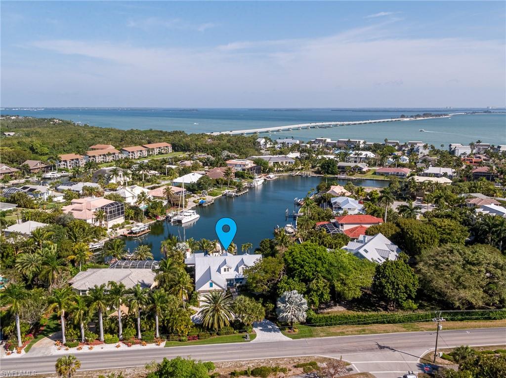 Simply Stunning!! Situated on Sanibel's premier waterfront location, direct deepwater access on a seawall canal with breathtaking views, this home has so much to offer!  Completely remodeled in 2019 with the highest quality details throughout the entire home.  Top grade technology installed throughout make this entirely a Smart Home.  Wolf and SubZero appliances, all impact rated glass, outdoor living space with masonry fireplace, built-in gas grill, drink station, large tv, surround sound, custom pool and hot tub.  Professional landscape by R.S. WALSH with numerous specimen plants and specialty palms, provides a lush tropical ambience and ultimate privacy.  Beautiful master suite with water views and custom indoor and outdoor showers.  Room for the whole family in this lovely 5 bedroom home including the upstairs bunk room with custom built in beds, game area and a custom home theater.  Entertaining spaces are endless!  Spacious driveway with basketball court and outdoor shower.