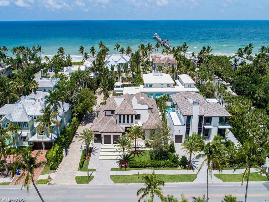 Ideally positioned just footsteps to the most iconic structure in Naples, the Naples Pier and beach, and a 2 minute walk to charming Third Street South shops and fine dining. Just completed by SGM Building Group, this Stofft Cooney designed Bali-infused home offers a fabulous great room plan featuring 4 bedrooms, a den and media room. The use of natural stones, light and dark woods, stainless steel accents, walls of sliding glass doors from the living areas and master bedroom open to the Zen-like outdoor living and entertaining area with beautiful tropical landscaping and great privacy. Lushly landscaped promenades and courtyards are lined with charming and historic architecture in the Third Street South shopping district just across the boulevard. The latest in couture design, fine art, and creative flair from around the world are yours to enjoy.