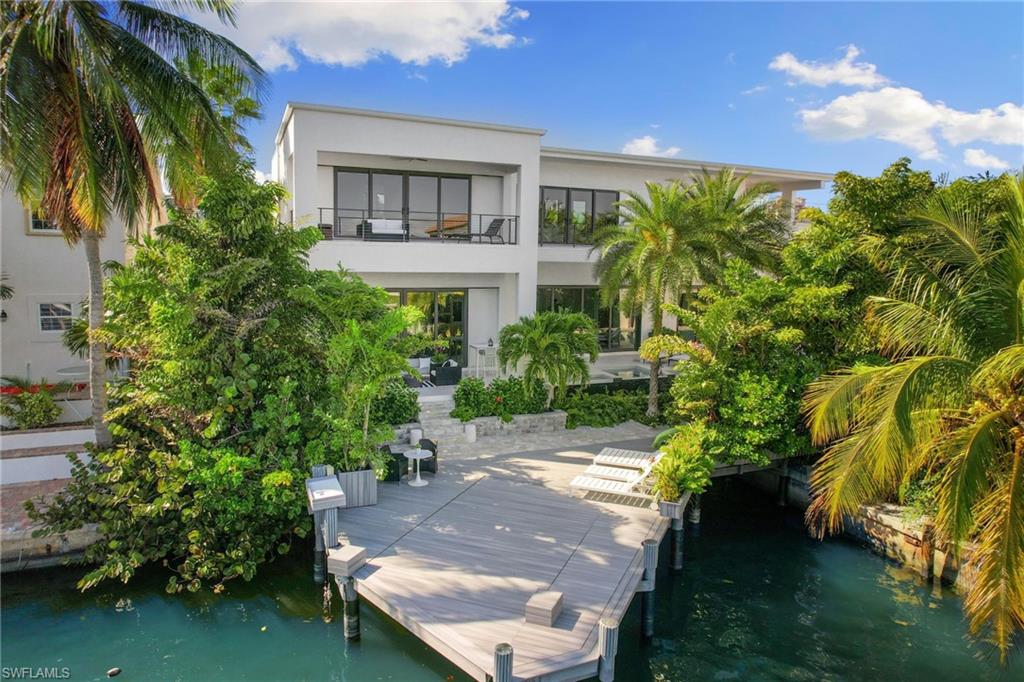 Step into a stunning two-story smart home where luxury meets laid-back coastal living, Designed for both relaxation and entertaining, this home showcases a resort-style lanai complete with a private pool, spa, waterfall, boat dock, outdoor kitchen, outdoor shower and a cozy sunken fire pit - your own personal paradise. Inside, you'll find two lavish primary suites - one on each floor - offering ultimate comfort and flexibility. The upstairs owner's retreat is a true showstopper, featuring a private bar, fully equipped gym, sunset-view balcony, spa-inspired bath with bidet smart toilet, and custom his-and-her walk-in closets. When you're ready to explore, Marco Walk Plaza id just minutes away, offering upscale shopping, dining, and entertainment to match your lifestyle. This isn't just a home -- It's a luxury experience waiting to be lived.