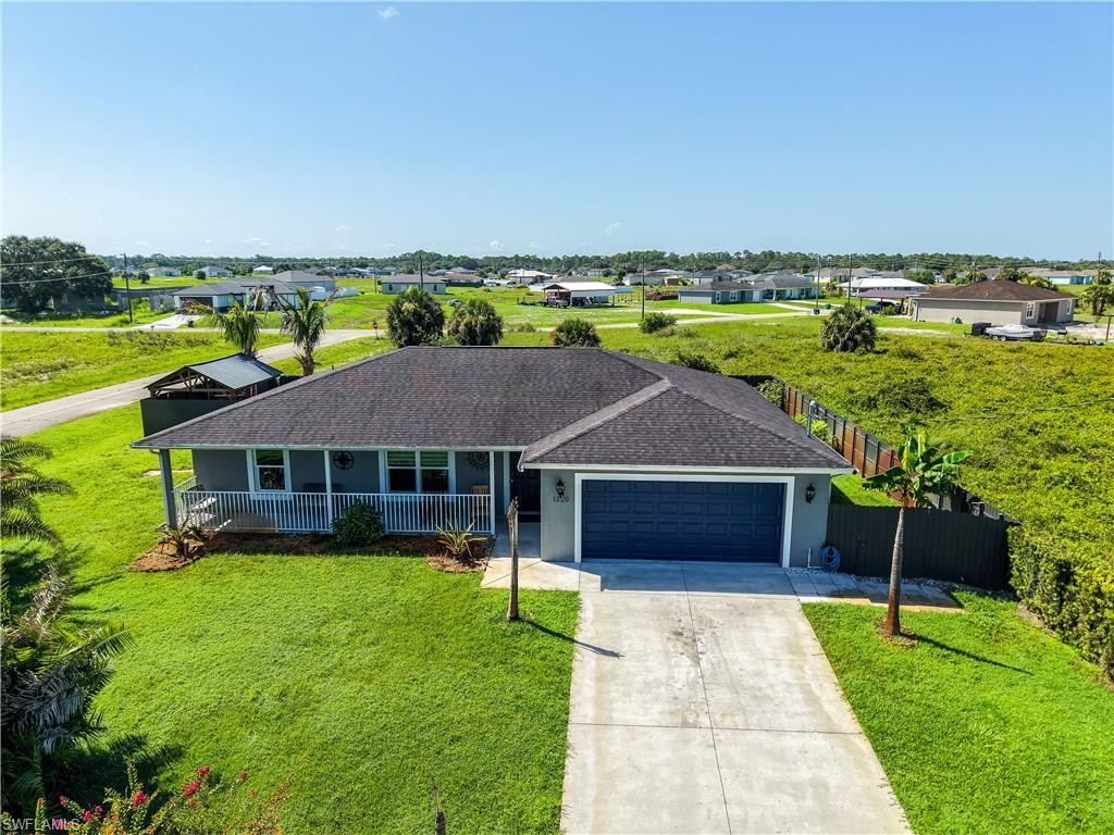 beautifully maintained one story ranch style home, on .28 acres 12197 sq ft corner home. No HOA 3-bedroom 2 full bathroom and a 2-car garage. bright open house layout great for entertaining from your kitchen to the living room a seamless and perfect flow for living and entertainment. Desirable split - bedroom floor plan with large windows in every room. Fully fenced in backyard and additional gazebo space allows for great outdoor entertaining and BBQ. while the large grassy area surrounds the home for plenty of room for playtime for the kids or grandkids. Impact resistant doors and windows, granite counter tops and solid wood cabinetry surround the kitchen. Enjoy the peaceful country life while still being able to cruise down to the beautiful gulf coast beaches also just a short ride to the east coast of Florida as well. don't let this opportunity to live the Florida lifestyle pass you by!!!!!
