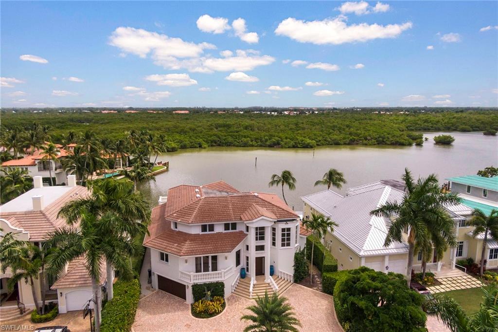 Brand new renovation! The interior of this gorgeous residence has been completely updated with a contemporary modern feel. The split bedroom, dual master floor plan with spectacular wide-water views has everything! Home features high ceilings, chef's kitchen with top of the line appliances including a 6 burner Wolf cook-top, dual Wolf wall ovens, Wolf convection oven, Wolf microwave, dual full-sized wine coolers, over-sized Sub-Zero refrigerator and refrigerator drawers, dual dishwashers and an abundance of counter space. All six bedrooms are large and feature en-suite baths. Other features of this desirable residence include a whole house generator multiple shower-heads, free standing soaking tub, over-sized closets and breathtaking water views. Entertaining has never been easier with expansive outdoor living space including heated pool/spa, outdoor kitchen and boat dock with lift providing direct access to Naples Bay and the Gulf of Mexico. Residence is finished with huge, air conditioned garage with room for five vehicles and a plethora of storage space. All just minutes from Naples' fine dining, world-class shopping and gorgeous white sand beaches!
