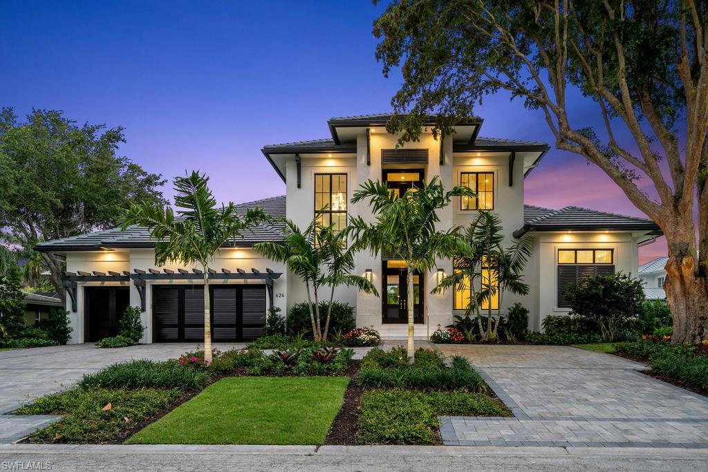 Situated on quiet Parkview Lane, 626 embodies the ultimate indoor-outdoor Naples lifestyle to provide an uplifting & peaceful retreat. Mahogany and glass front doors opens to clear views through the open concept main living area out to the expansive outdoor living space. Outside, the southern exposure pool deck features custom pool & spa, fire table, covered outdoor kitchen & dining, and lounge spaces to enjoy warm sunshine and relaxing shade. Scenic views to the west from the balcony over lush treetops offer the perfect way to enjoy a famous Naples sunset. Inside, an impressive 3-sided glass temp controlled 270 bottle wine display (or future elevator in place of display) sets the stage for the home, which boasts Legno Bastone white oak floors, custom cabinets, chef's kitchen complete with Sub-Zero/Wolf gas appliances, and exquisite finishes and features throughout. The lovely master suite, office, Jr. Master suite, & laundry complete the first floor. A large upstairs loft space with two balconies & two en-suite guest rooms complete the home. Park Shore residents enjoy optional HOA membership with private beach park access & option to purchase boat slip at Venetian Bay Yacht Club!