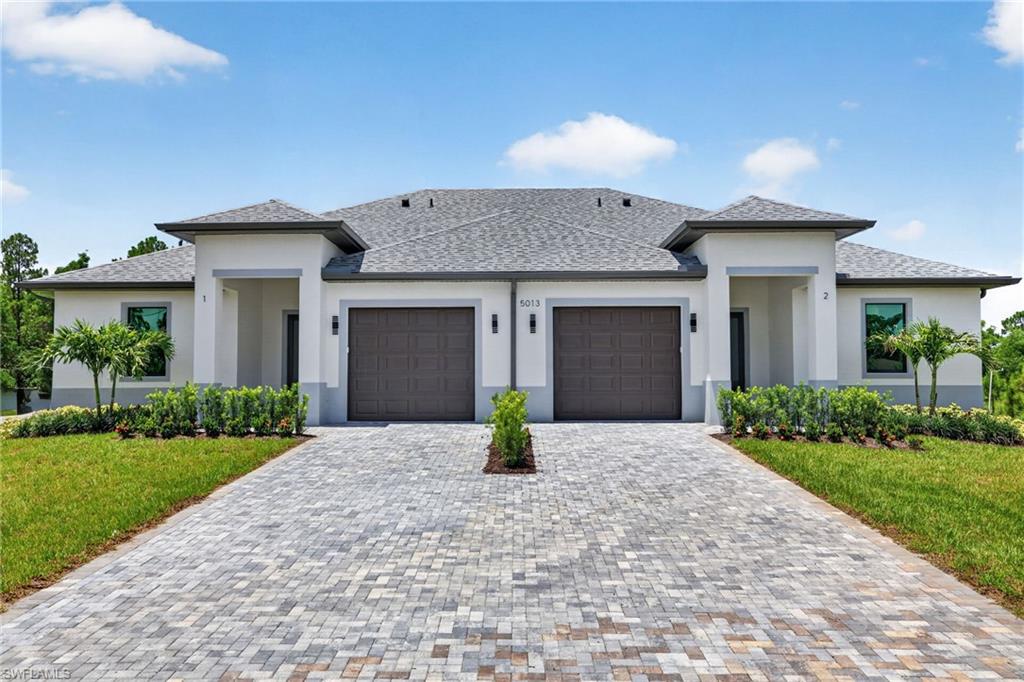 Stunning New Construction Duplex centrally located in Lehigh Acres, FL. This incredible opportunity offers all the benefits of living in a beautiful brand new construction while bringing in income; or simply purchasing as an investment property. Either way this property will not disappoint you. This high quality new-build showcases an open floor plan with great attention to details. A bright and airy main living space; tile throughout; fresh white kitchen with quartz countertop, waterfall island, beautiful light colored backsplash, and 42" wood cabinets; 9'4" ceilings and 10'4" high tray ceilings in the living room and master bedroom; 8-ft doors; IMPACT windows and doors for safety; a spacious patio; automated sprinkler system; and paved driveway. Truly a must see!