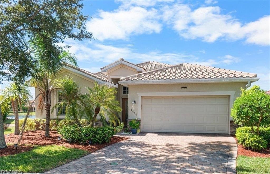 Beautiful 4-bedroom, 3-bathroom home with a 2-car garage located in the desirable gated community of Olympia Pointe. This well-maintained property features tile flooring throughout the main living areas, with cozy carpet in the bedrooms. The spacious primary suite offers a luxurious en-suite bathroom complete with dual sinks, a soaking tub, and a separate walk-in shower. The kitchen is equipped with granite countertops and stainless steel appliances, opening seamlessly to an inviting living space—perfect for entertaining. Enjoy Florida living at its best with a screened-in lanai and a paver driveway that enhances the home’s curb appeal. Olympia Pointe offers fantastic community amenities, including a resort-style pool, fitness center, playground, and tennis courts—providing something for everyone. Conveniently located with easy access to shopping, schools, public transportation, and I-75, this home truly combines comfort, style, and convenience.