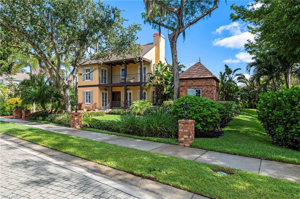 Welcome to this exquisite estate located in the prestigious Hemingway Place Community of Naples, Florida—a true sanctuary designed for refined living and relaxation. Every detail of this home has been meticulously crafted to provide unparalleled comfort, modern convenience, and timeless elegance. Featuring over 4,200 sq ft with 4 bedrooms, den, media room and 5 total baths, the home is elevated over 13 ½ feet, higher than the surrounding neighborhood, offering peace of mind.  It has never experienced flooding.  The exterior showcases a freshly painted façade and professionally landscaped grounds that create a lush, tropical backdrop. A private courtyard pool invites relaxation and entertainment, enhanced by nine surround-sound speakers and a tranquil view of a preserved one-acre park—ensuring uninterrupted privacy with no future development. The charming pool house offers additional space for guests or quiet retreats, while the driveway, walkways, and exterior accents are classic Chicago brick, lending a touch of historic character to the property. Inside, the spacious first-floor master suite overlooks the park and pool and features a marble bathroom and dual walk-in closets. A separate guest wing includes two generously sized bedrooms, each with an ensuite bath, and a dedicated sitting area. The home also boasts a large media room with surround sound for movie nights, two working fireplaces—one indoors and one on the outdoor patio.  Unique architectural details including a cove ceiling in the master suite, a coffered ceiling in the study, and antique ceiling fans add charm and distinction. Also included is a full-house generator powered by a 1000-gallon propane tank, a premium HALO water filtration system for pure water throughout the home, and a newly upgraded garage featuring an epoxy floor and EV charger. Elegant walnut wood flooring and polished travertine stone adorn the main level, complemented by exposed cypress wood beams and Chicago brick accents that add warmth and sophistication. Whether you're enjoying the media room, relaxing by the pool, or admiring the views from the two expansive porches or Juliet balcony, this home offers the ultimate blend of comfort, style, and luxury. Hemingway Place is ideally located across US 41 from Park Shore; one mile from the beach and the many shops and restaurants of Venetian Village. Only 4 miles to downtown 5th Avenue, 3rd Street South and the famous Naples fishing pier. Don't miss this rare opportunity to own a truly remarkable estate in one of Naples, FL most coveted locations.